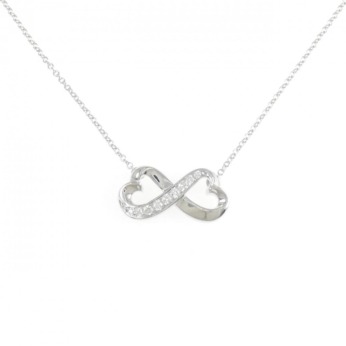 Tiffany Double Loving Heart Necklace: --- Catalog ---Category: SizePendant Size: 8.4mm x 17.7mm / 0.33'' x 0.69''Neck Circumference: 38 cm / 14.96''Category: DesignStone: DiamondGender: WomenMaterial: White gold (18K)Pendant Type: Pendant
