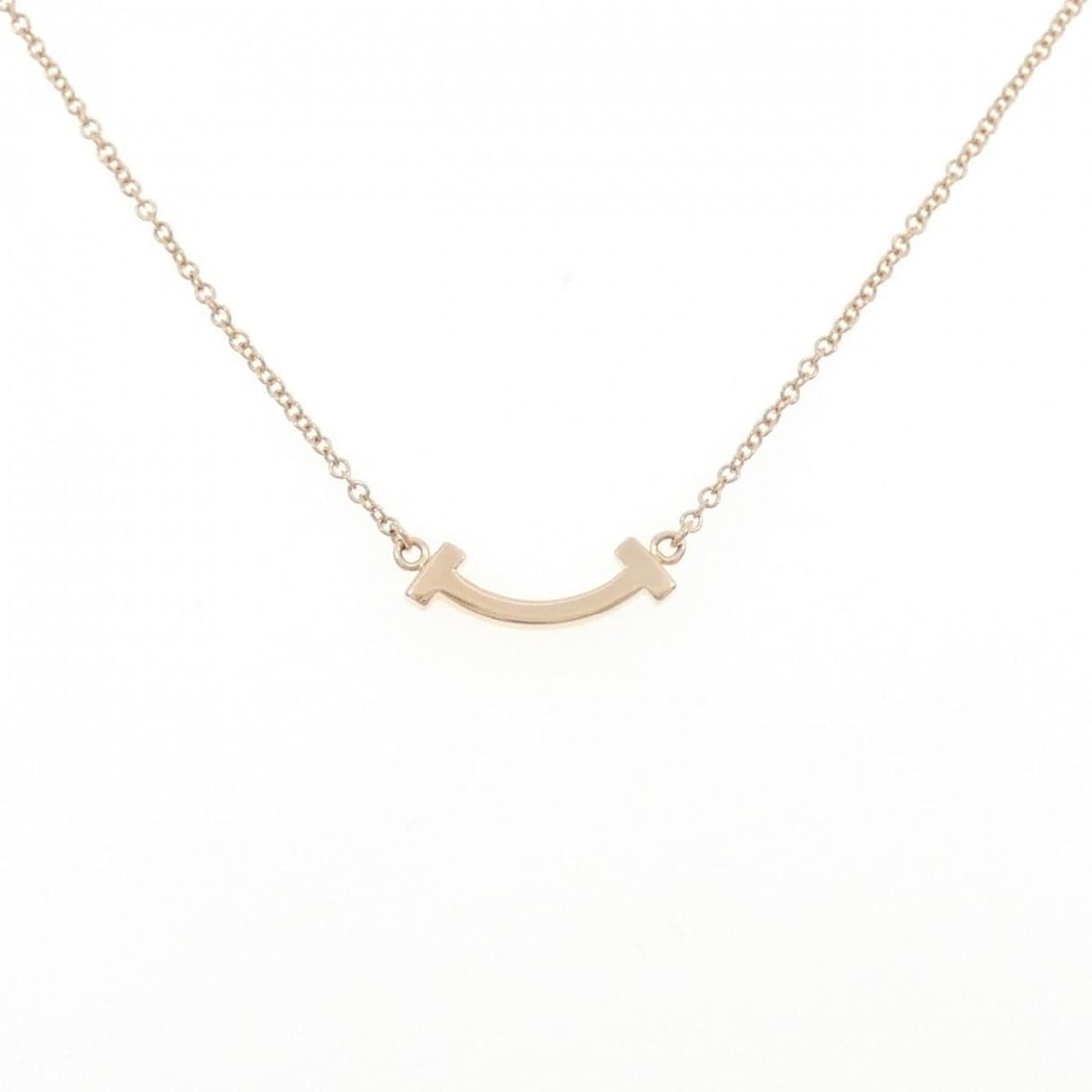 Tiffany T Smile Mini Necklace: --- Catalog ---Category: SizePendant Size: 3.5mm x 13.4mm / 0.13'' x 0.52''Neck Circumference: 40 cm - 46 cm / 15.74'' - 18.11''Category: DesignGender: WomenMaterial: Pink gold (18K)Pendant Type: Pend