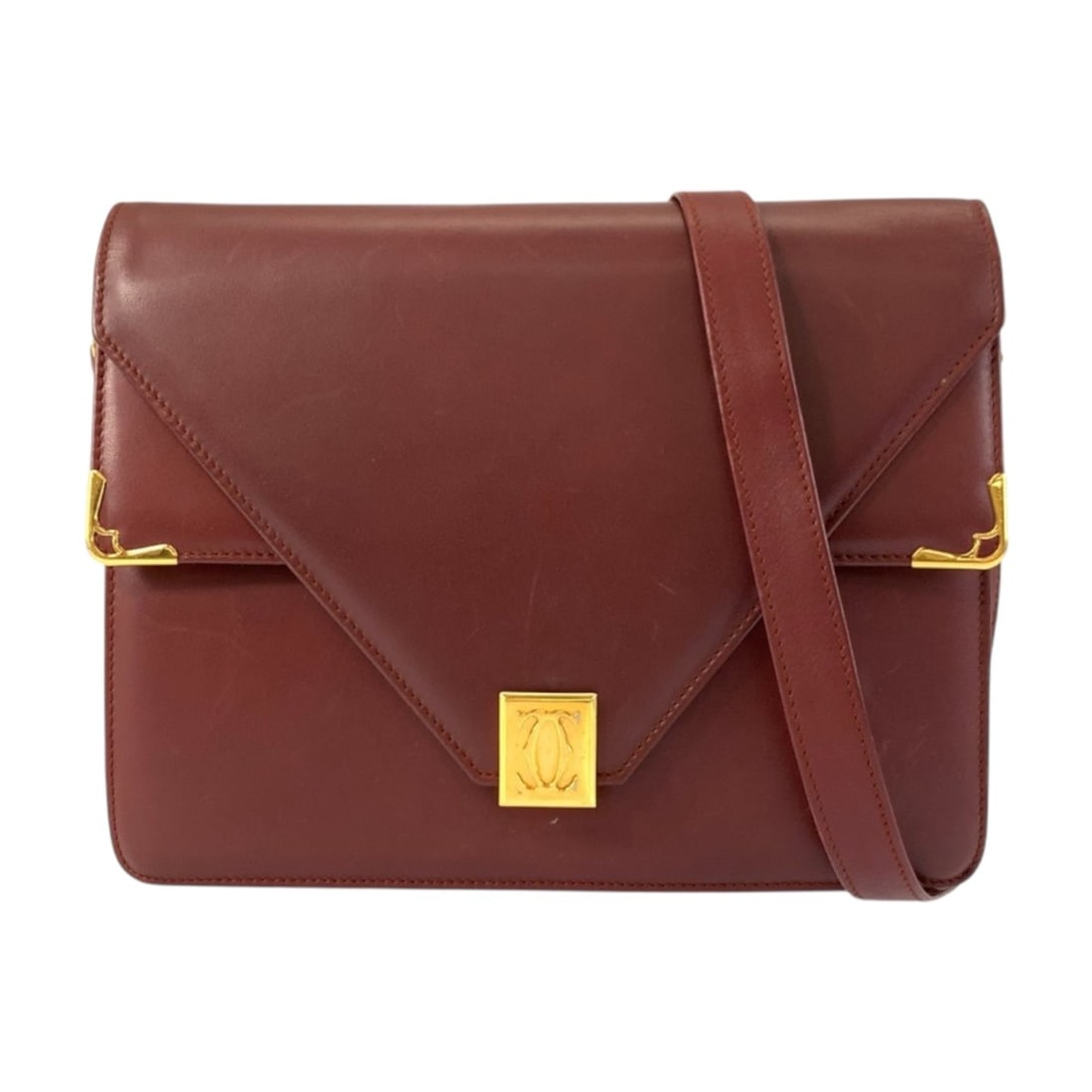 CARTIER Vintage Must Line Bordeaux Leather Shoulder Bag with Gold Hardware for Women: --- Catalog ---Category: SizeSize (HxWxD): 18cm x 24cm x 3.5cm / 7.08'' x 9.44'' x 1.37''Category: DesignType: Pochette, Shoulder bagColor: BordeauxGender: WomenMaterial: Leather Category: GeneralBran