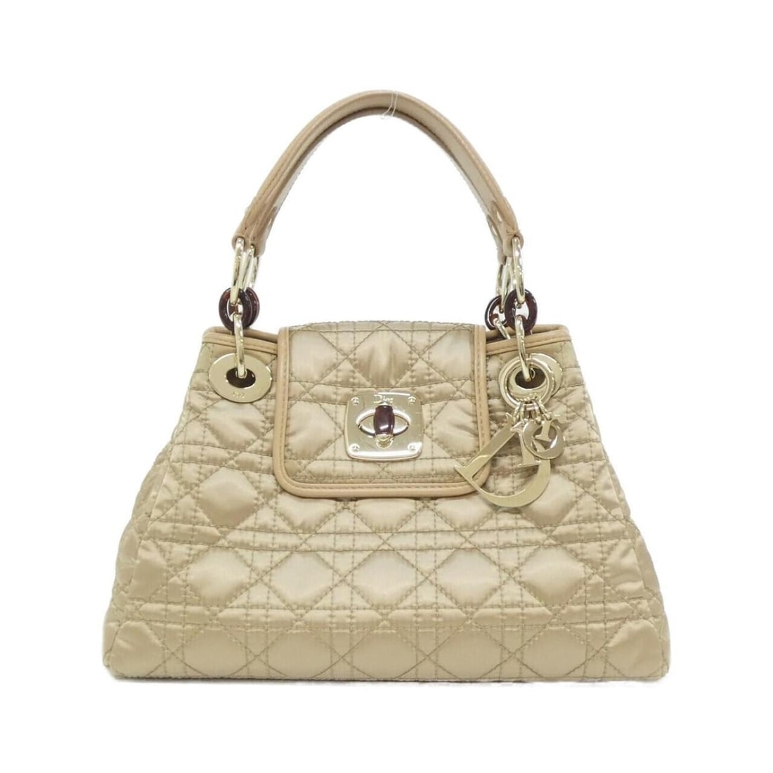 Christian Dior Charming Lock handbag: --- Catalog ---Category: SizeSize (HxWxD): 18cm x 28cm x 11cm / 7.08'' x 11.02'' x 4.33''Category: DesignType: HandbagColor: BeigeGender: WomenMaterial: Nylon , Leather Category: GeneralBrand: