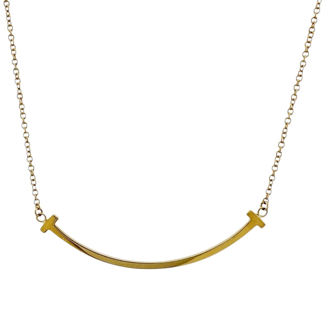 Tiffany T Smile Necklace, 18k Gold, Women's, Pre-owned, TIFFANY & Co.: --- Catalog ---Category: SizeWeight: 2.7g / 0.09oz.Pendant Size: 9mm x 37.5mm / 0.35'' x 1.47''Neck Circumference: 46 cm / 18.11''Category: DesignColor: YellowMetal: GoldGender: WomenMetal Purity: 18K