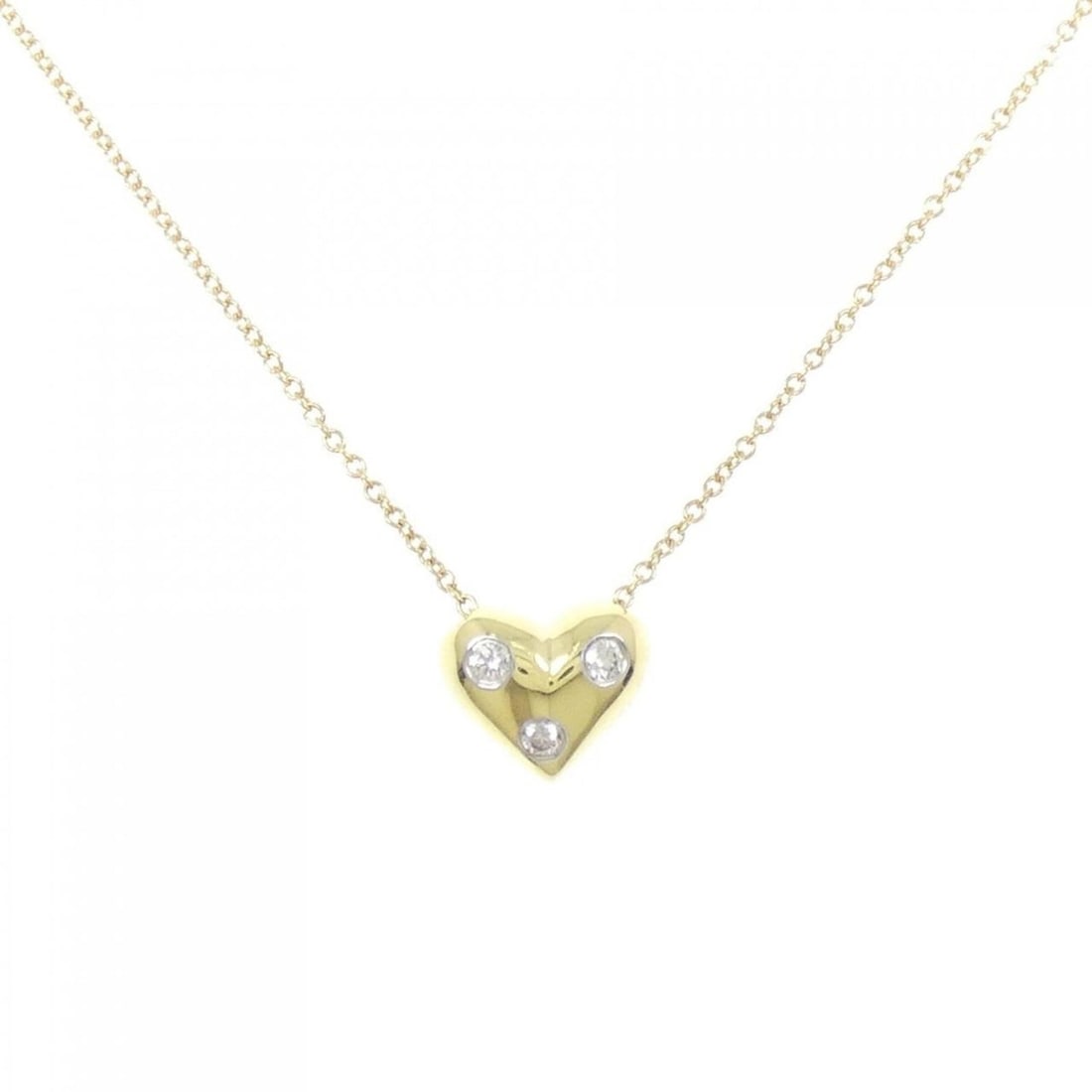 Tiffany & Co. Dots Pinched Heart Necklace: --- Catalog ---Category: SizePendant Size: 8.1mm x 9.7mm / 0.31'' x 0.38''Neck Circumference: 41 cm / 16.14''Category: DesignStone: DiamondGender: WomenMaterial: Platinum 950, Yellow gold