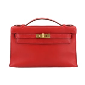 Hermes Hermès Pochette Kelly handbag in Swift, Rouge Cazac with X markings and gold hardware.