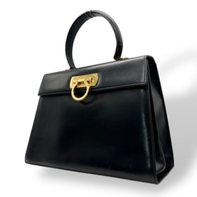 Salvatore Ferragamo Gancini handbag in black calf leather with gold hardware.