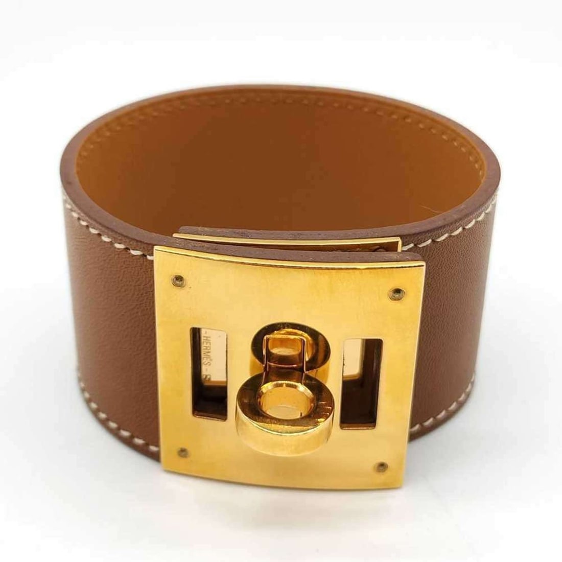 Hermes Hermès Kelly Dog Bangle Bracelet in Brown Box Calf Leather: --- Catalog ---Category: SizeLength: 14cm - 16cm / 5.51'' - 6.29''Category: DesignType: BangleColor: BrownGender: WomenMaterial: Box calf leatherCategory: GeneralBrand: Hermes--- Item List ---Section: