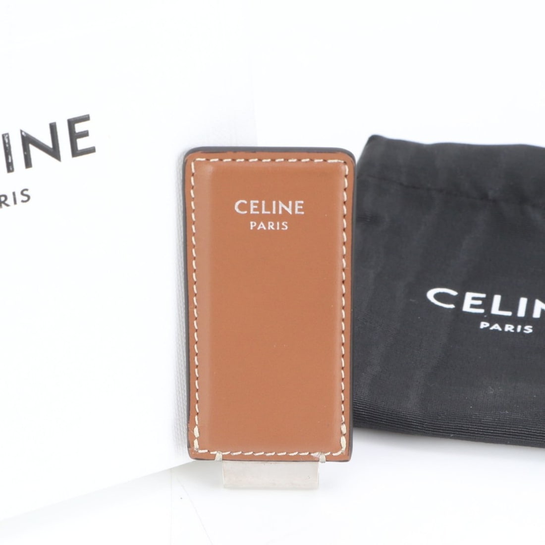 Celine Men's Leather Money Clip Wallet in Brown with Silver Hardware: --- Catalog ---Category: SizeSize (HxWxD): 7.5cm x 3.5cm / 2.95'' x 1.37''Category: DesignType: Money clipColor: BrownGender: MenMaterial: Leather Category: GeneralBrand: CelineCountry of Origin: Ital