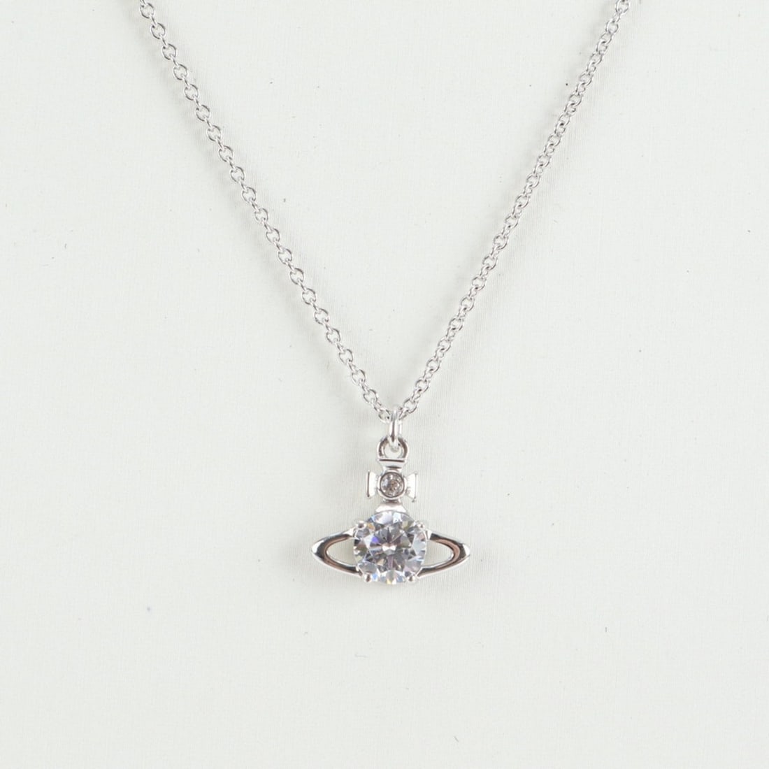 Vivienne Westwood Ove Rhinestone Necklace Silver Accessory for Women: --- Catalog ---Category: SizePendant Size: 13mm x 15mm / 0.51'' x 0.59''Neck Circumference: 26.5 cm / 10.43''Category: DesignColor: SilverGender: WomenNecklace Type: NecklaceCategory: GeneralBrand: Vi