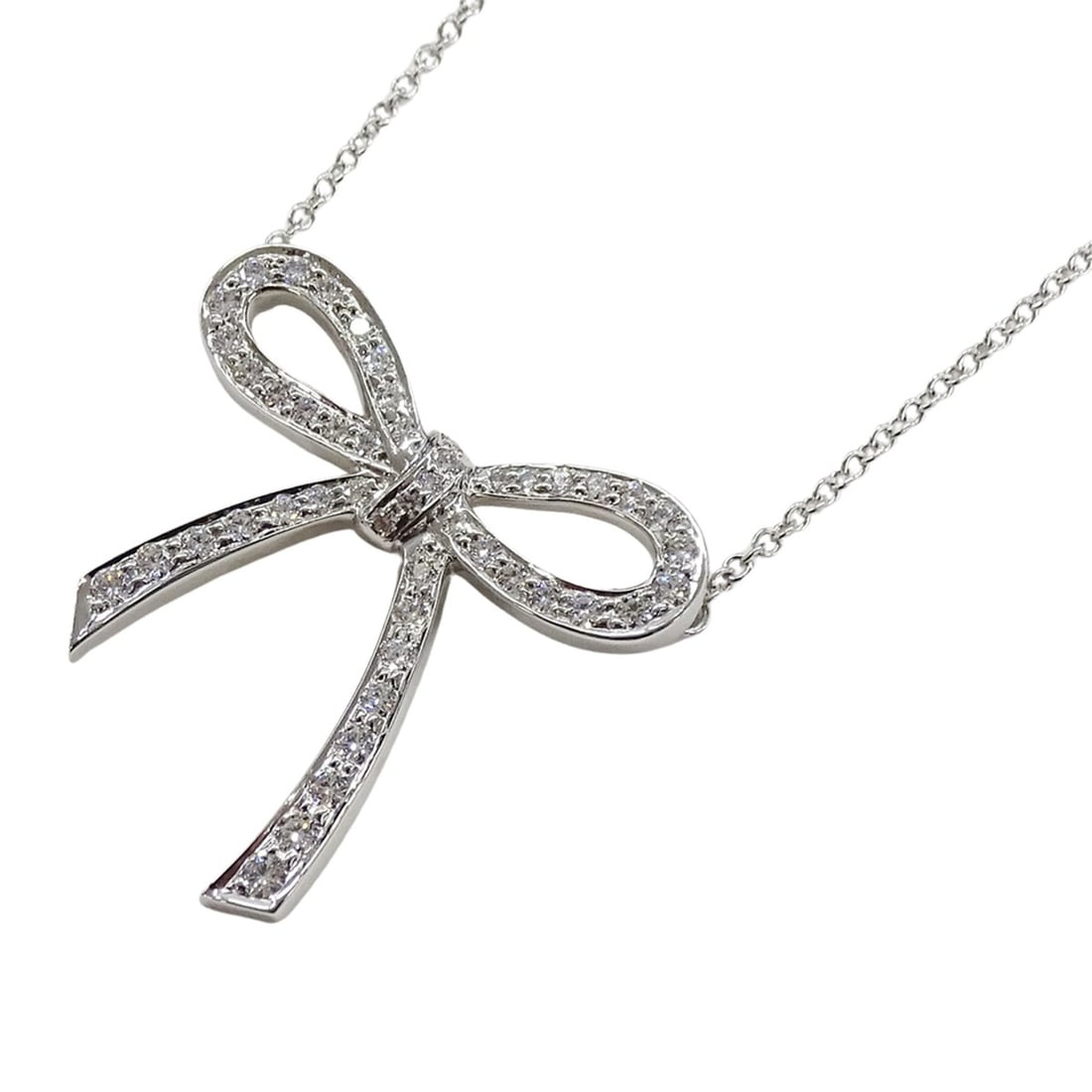Tiffany & Co. Women's Diamond Bow Ribbon Necklace in PT950 Platinum, Polished: --- Catalog ---Category: SizePendant Size: 21.9mm x 22mm / 0.86'' x 0.86''Neck Circumference: 40.5 cm / 15.94''Category: DesignColor: SilverStone: DiamondGender: WomenMaterial: Silver 925Necklace Type