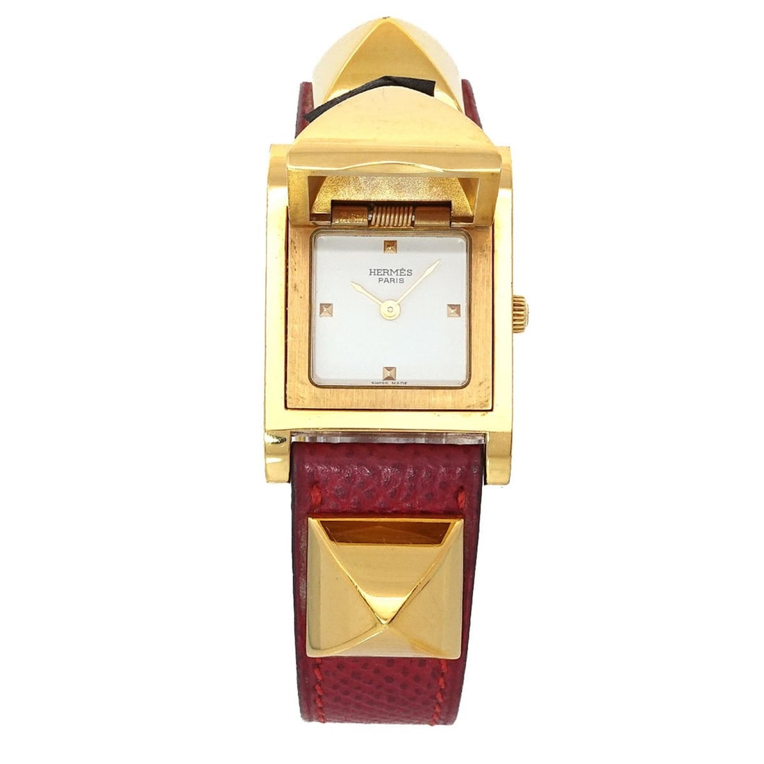 Hermès Medor Women's Pyramid Gold Stud Watch in White and Red Leather with Quartz Movement: --- Catalog ---Category: SizeWrist Size: 14cm - 16.5cm / 5.51'' - 6.49''Case Diameter: 23mm / 0.91''Category: DesignType: WristwatchGender: WomenColor (Dial): WhiteMaterial (Band): Gold plated, Leathe