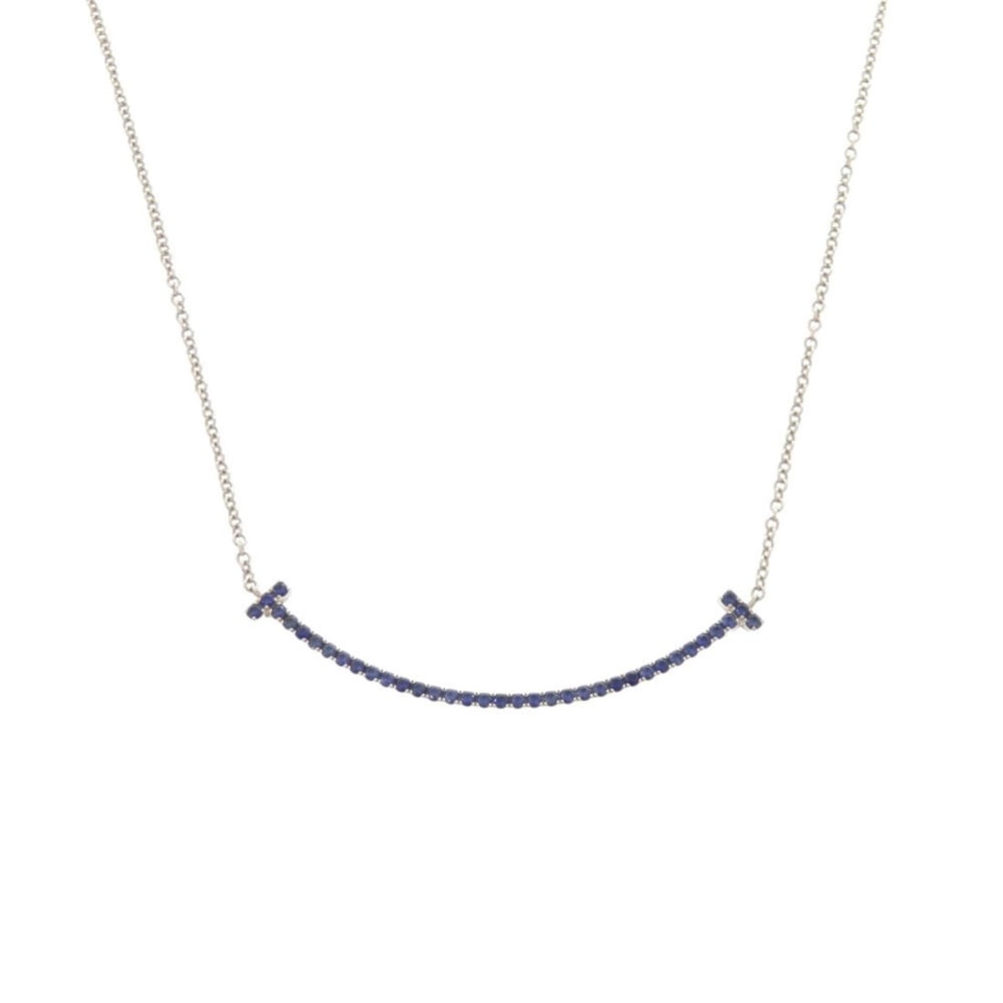 Excellent condition Tiffany T Smile small necklace in 18K white gold with sapphire and 750 gold.: --- Catalog ---Category: SizeNeck Circumference: 41 cm / 16.14''Category: DesignColor: Blue, White goldGender: WomenMaterial: White gold (18K)Necklace Type: NecklaceCategory: GeneralBrand: Tiffany---