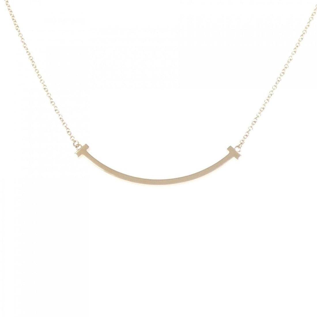 Tiffany T Smile Small Necklace: --- Catalog ---Category: SizePendant Size: 3.6mm x 37.3mm / 0.14'' x 1.46''Neck Circumference: 41 cm - 45 cm / 16.14'' - 17.71''Category: DesignGender: WomenMaterial: Pink gold (18K)Pendant Type: