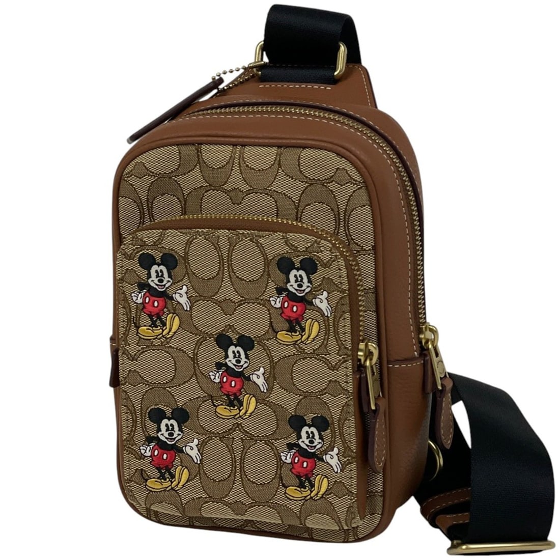 Coach Track Pack 14 Mickey Mouse Disney Signature Crossbody Bag in Brown Canvas (CM721) for Women: --- Catalog ---Category: SizeSize (HxWxD): 20.5cm x 14cm x 6cm / 8.07'' x 5.51'' x 2.36''Category: DesignType: Sling bagColor: BrownGender: WomenMaterial: Canvas , Leather Category: GeneralBrand: Coac