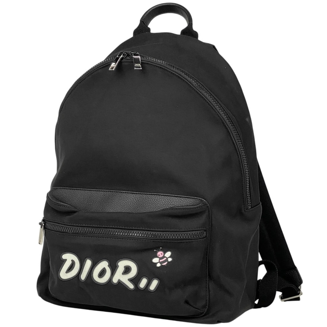 Christian Dior KAWS Bee Motif Backpack/Daypack/Rucksack in Black Nylon for Women: --- Catalog ---Category: SizeSize (HxWxD): 42cm x 29cm x 13cm / 16.53'' x 11.41'' x 5.11''Category: DesignType: BackpackColor: BlackGender: WomenMaterial: Nylon , Leather Category: GeneralBrand: Chris