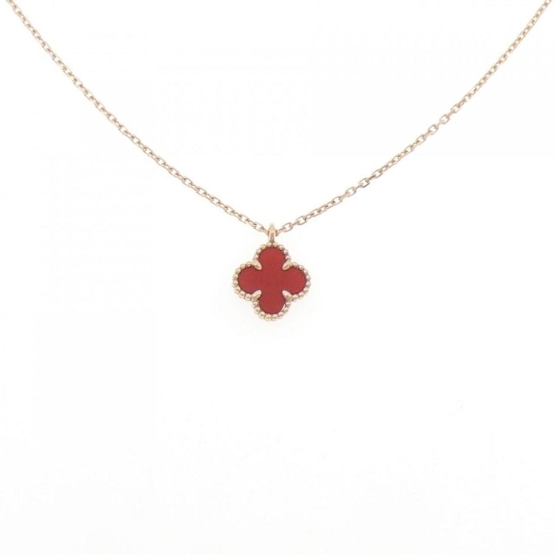 Van Cleef & Arpels Sweet Alhambra Necklace: --- Catalog ---Category: SizePendant Size: 9.1mm x 9.1mm / 0.35'' x 0.35''Neck Circumference: 39 cm - 41 cm / 15.35'' - 16.14''Category: DesignStone: CarnelianGender: WomenMaterial: Pink gold (18K)Pen