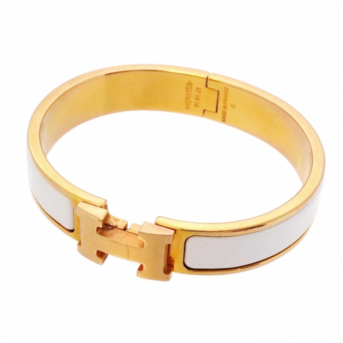 Hermes Click-Clack PM Bangle in GP-Plated Gold and White, Women's, P2032117: --- Catalog ---Category: SizeLength: 15.5cm / 6.1''Category: DesignType: BangleColor: Gold, WhiteGender: WomenMaterial: Gold platingCategory: GeneralBrand: Hermes--- Item List ---Section: ConditionRan