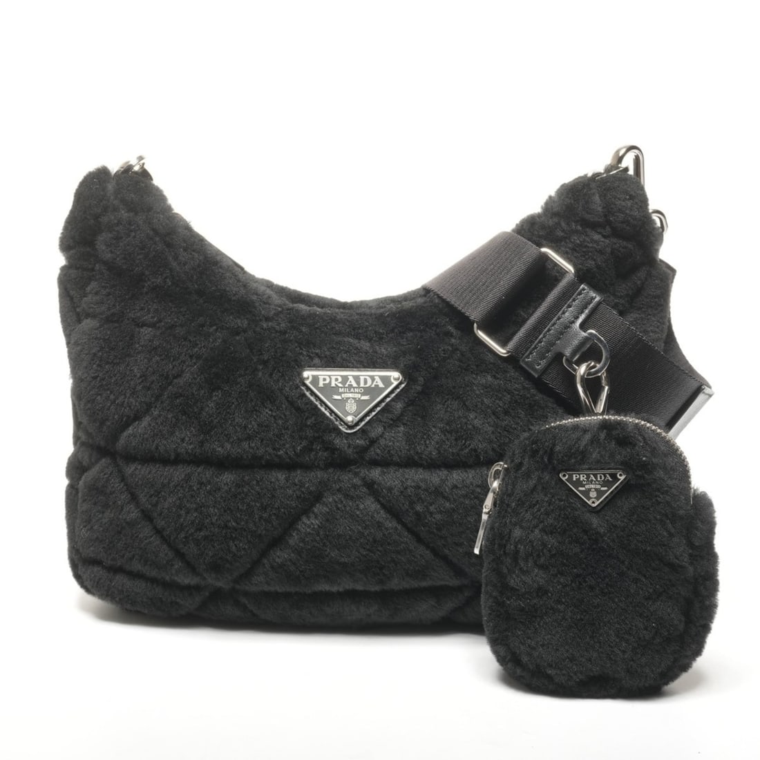 Prada Boa Mouton Shoulder Bag in Black: --- Catalog ---Category: SizeSize (HxWxD): 18cm x 9cm x 2cm / 7.08'' x 3.54'' x 0.78''Category: DesignType: Pouch, Shoulder bagColor: BlackGender: WomenCategory: GeneralBrand: PradaCountry of Origin:
