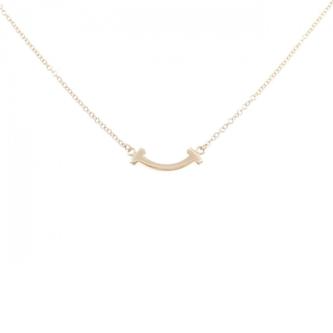 Tiffany T Smile Mini Necklace: --- Catalog ---Category: SizePendant Size: 3.6mm x 13.4mm / 0.14'' x 0.52''Neck Circumference: 41 cm - 46 cm / 16.14'' - 18.11''Category: DesignGender: WomenMaterial: Pink goldPendant Type: PendantNec
