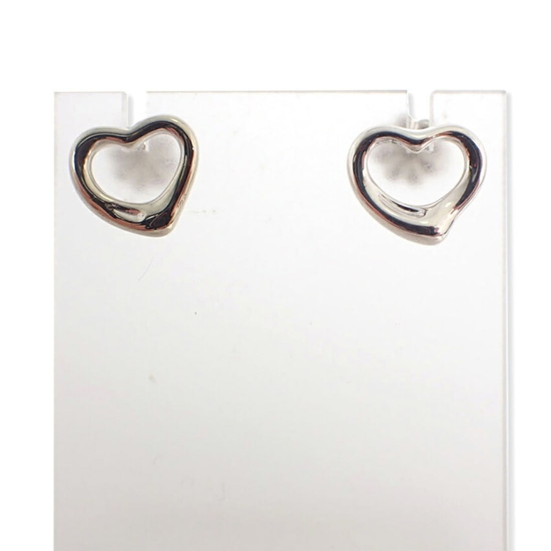 TIFFANY 925 heart earrings: --- Catalog ---Category: SizeSize (HxWxD): 9.00mm x 10.00mm / 0.35'' x 0.39''Category: DesignType: Stud earringsGender: WomenMaterial: Sterling silver 925Category: GeneralBrand: Tiffany--- Item List -