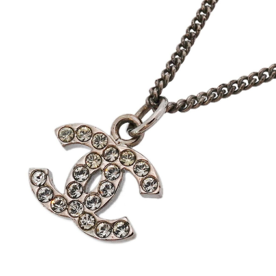 Chanel Coco Mark Metal Rhinestone Silver Necklace for Women: --- Catalog ---Category: SizePendant Size: 18.7mm x 14.6mm / 0.73'' x 0.57''Neck Circumference: 42 cm / 16.53''Category: DesignColor: SilverGender: WomenMaterial: Metal, RhinestoneNecklace Type: Neckl