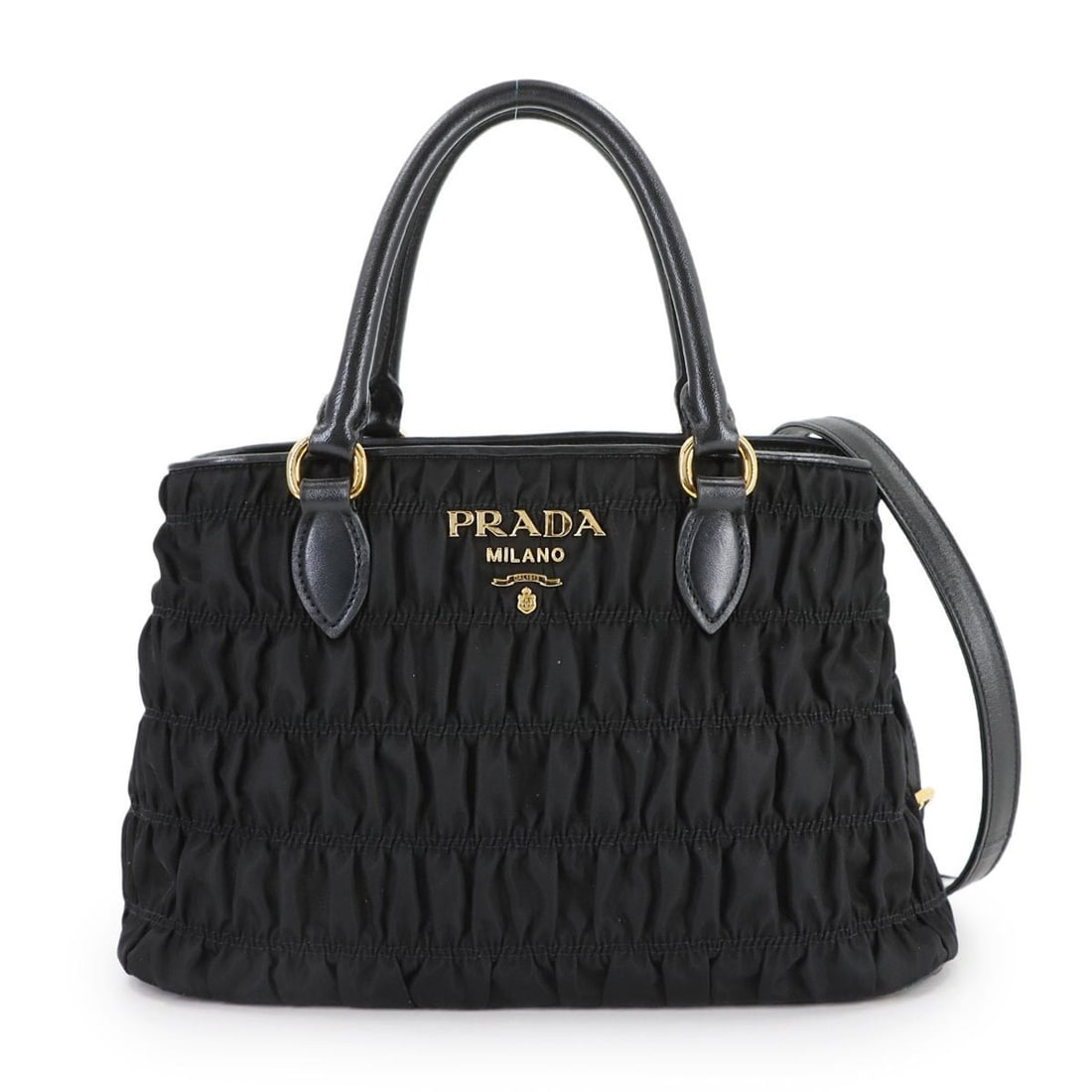 Prada 2-way hand shoulder bag in nylon and leather, nero black, 1BA173.: --- Catalog ---Category: SizeSize (HxWxD): 18.5cm x 29.5cm x 14cm / 7.28'' x 11.61'' x 5.51''Category: DesignType: Handbag, Shoulder bagColor: Black, NeroGender: WomenMaterial: Nylon , Leather Categor