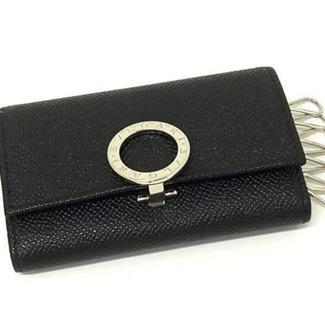 BVLGARI Key Case 30422 Black Leather Men's/Women's 6-Clip: --- Catalog ---Category: DesignType: KeycaseColor: BlackGender: Men,Women,UnisexMaterial: Leather Number of Key Hooks: 6Category: GeneralLine: Bvlgari BvlgariBrand: BvlgariCountry of Origin: ItalyCate