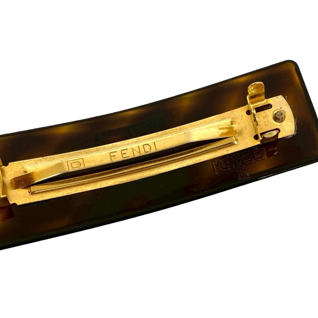 FENDI FF logo motif GP barrette hair accessory in brown and gold (61081): --- Catalog ---Category: SizeSize (LxW): 3cm x 9.5cm / 1.18'' x 3.74''Category: DesignType: BarretteColor: Brown, GoldGender: WomenMaterial: Gold platingCategory: GeneralBrand: Fendi--- Item List ---S