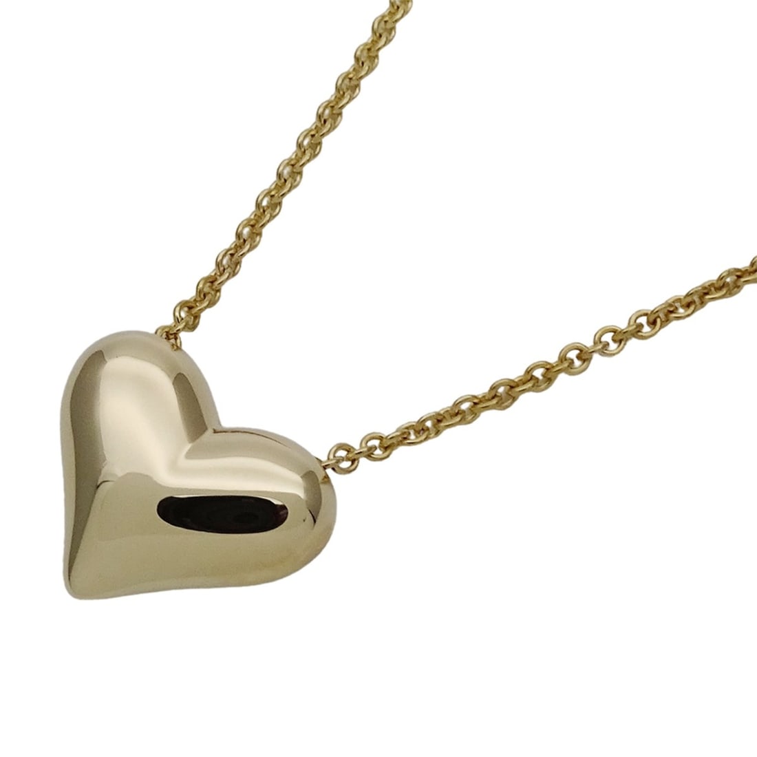 Tiffany & Co. Women's Pinched Heart Pendant Necklace in 750YG Yellow Gold, Polished: --- Catalog ---Category: SizePendant Size: 12.6mm x 15.3mm / 0.49'' x 0.6''Neck Circumference: 40.5 cm / 15.94''Category: DesignColor: Yellow goldGender: WomenMaterial: Yellow gold (18K)Pendant Type: