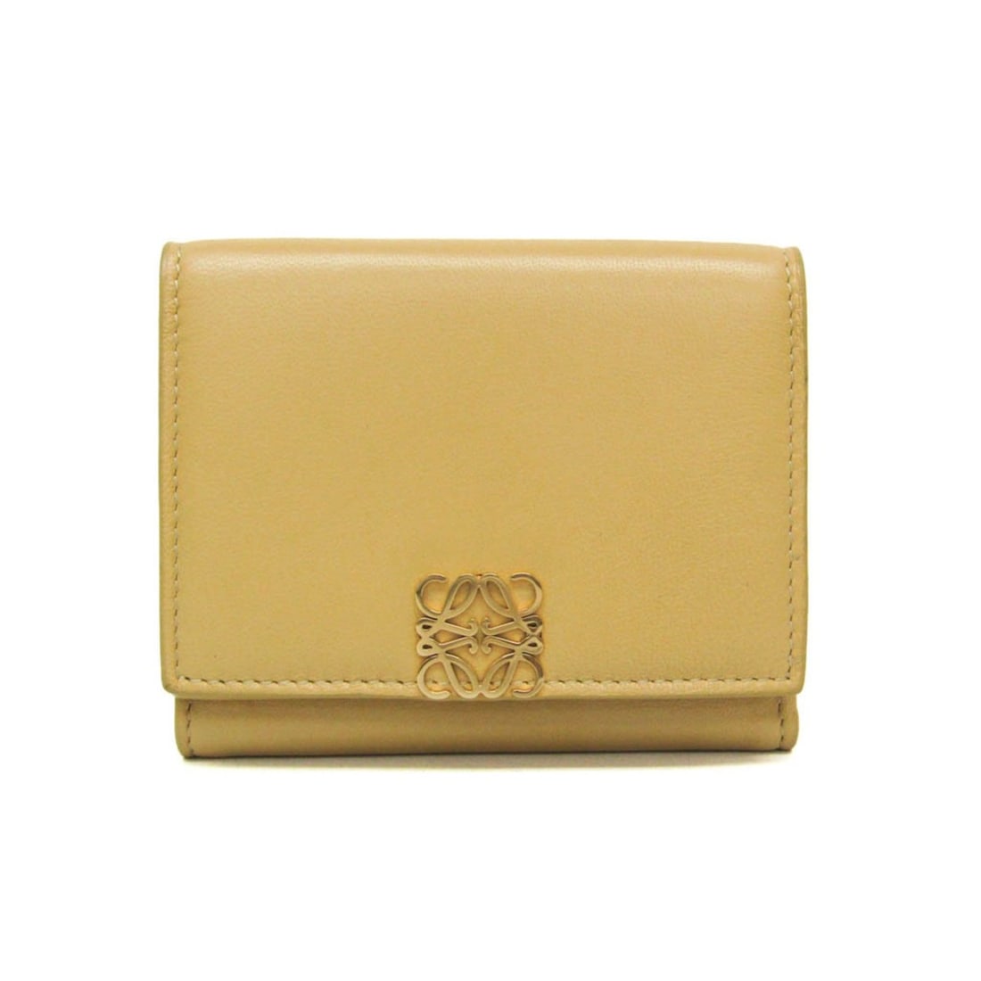 Loewe Anagram Trifold Wallet Women's Leather Wallet (tri-fold) Mustard: --- Catalog ---Category: SizeSize (HxWxD): 8.5cm x 10.5cm x 3cm / 3.34'' x 4.13'' x 1.18''Category: DesignType: Wallet (tri-fold)Color: MustardGender: WomenClosure: Snap fastenerMaterial: Leather Inne