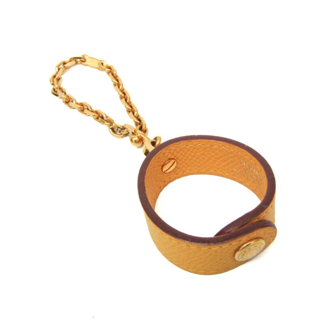 Hermes Nomade Women's Glove Holder Gold,Yellow: --- Catalog ---Category: SizeWeight: 11.2g / 0.39oz.Size (HxWxD): 10.5cm x 3.5cm x 1.5cm / 4.13'' x 1.37'' x 0.59''Handle/Strap Length: 13cm / 5.11''Category: DesignType: Glove holderColor: Gold, Yell