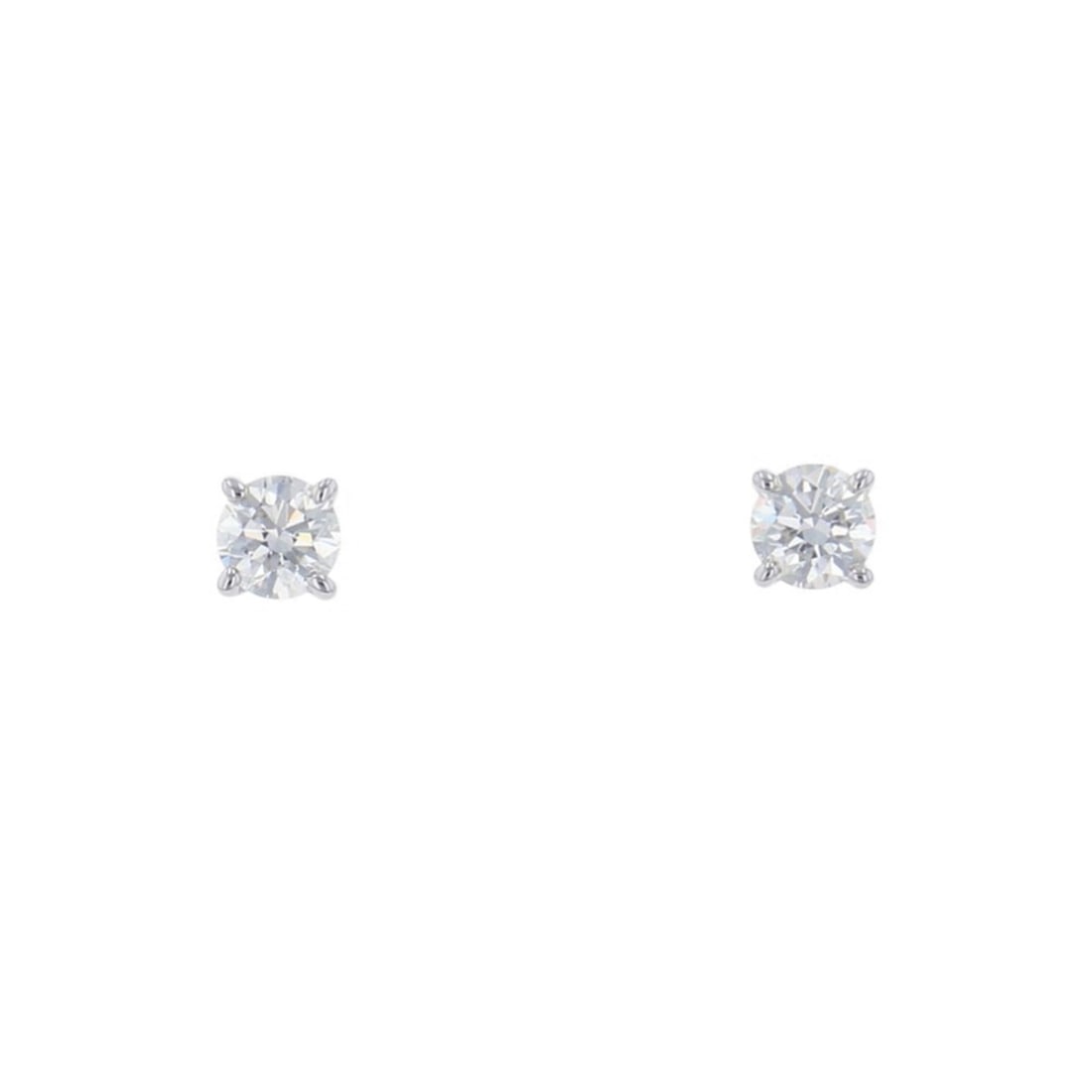 Tiffany & Co. solitaire diamond stud earrings with two diamonds totaling approximately 0.27 carats.: --- Catalog ---Category: SizeWeight: 1.2g / 0.04oz.Diameter: 3.4mm / 0.13''Category: DesignType: Stud earringsStone: DiamondGender: WomenMaterial: Platinum 950Weight (ct.): 0.27Category: GeneralBrand:
