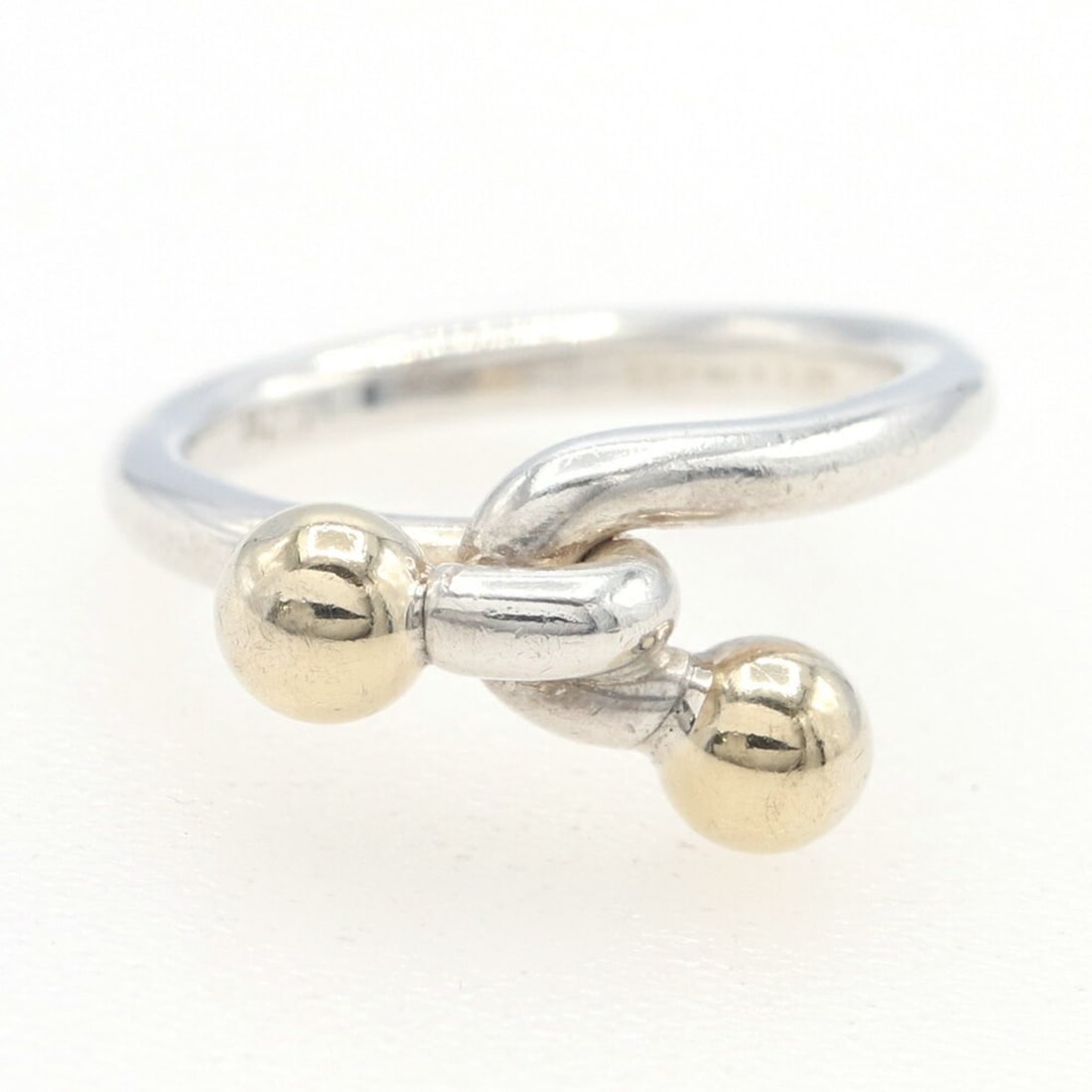 Tiffany & Co. Love Knot Ring, SV, Sterling Silver 925, 750, YG, US 2.5/JP 3, Pinky Combination,: --- Catalog ---Category: SizeJP Size: 3US Size: 2.5Category: DesignType: Band ringGender: WomenMaterial: Sterling silver 925, Yellow gold (18K)Category: GeneralBrand: Tiffany--- Item List ---Section: