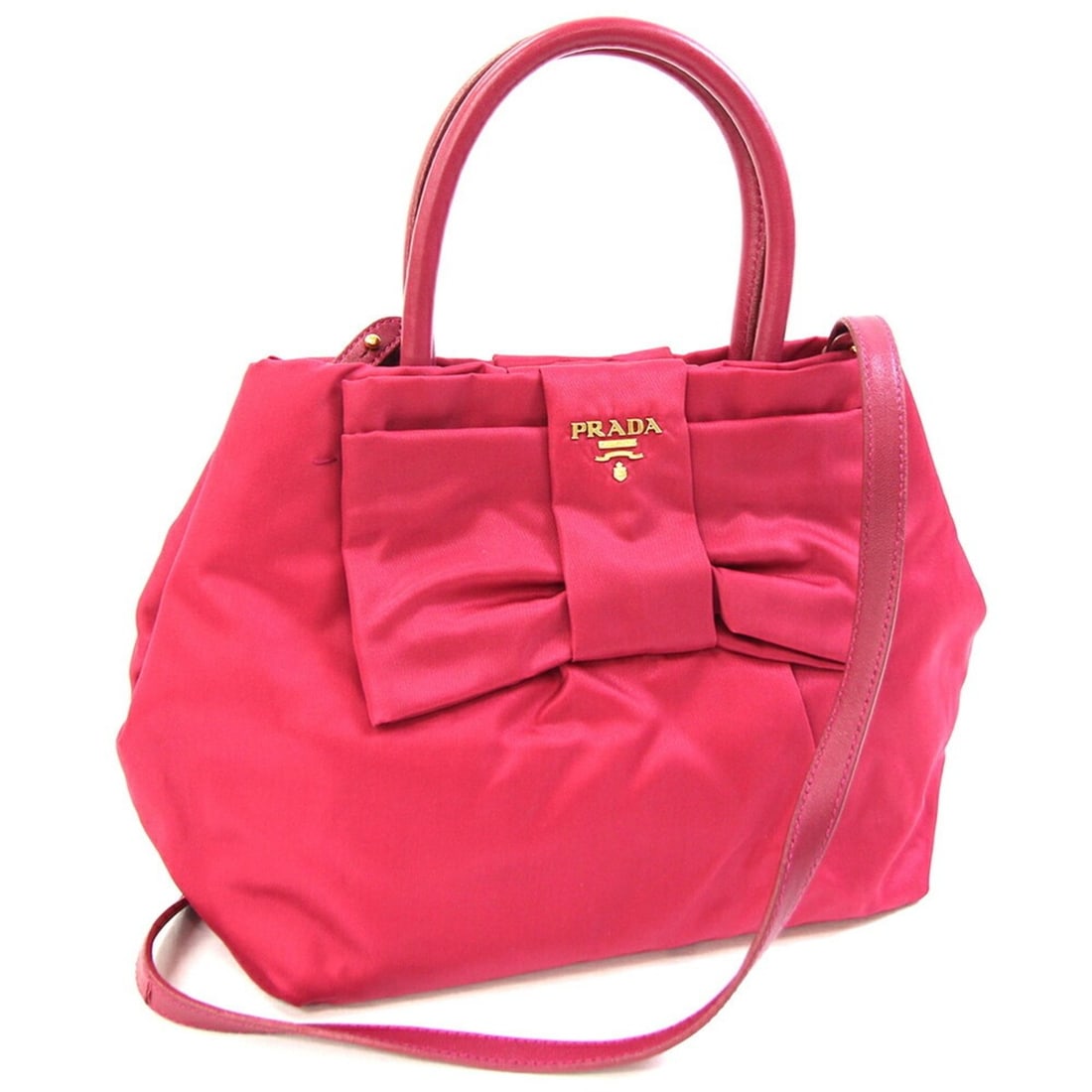 Prada Handbag BN1604 Pink Nylon and Leather Shoulder Bag with Ribbon for Women: --- Catalog ---Category: SizeSize (HxWxD): 20cm x 30cm x 13cm / 7.87'' x 11.81'' x 5.11''Category: DesignType: Handbag, Shoulder bagColor: PinkGender: WomenMaterial: Nylon , Leather Category: GeneralM