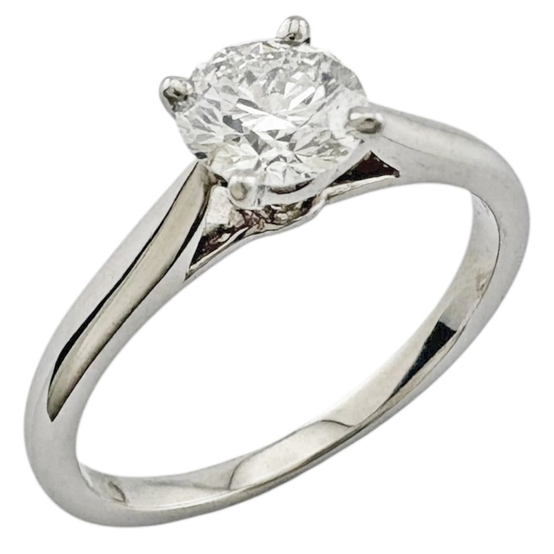 Pre-owned Cartier solitaire ring in platinum with a 0.46ct diamond.: --- Catalog ---Category: PackNumber in Pack: 1Category: SizeWeight: 2.7g / 0.09oz.JP Size: 7US Size: 4Category: DesignType: Engagement ringMetal: PlatinumStone: DiamondGender: WomenMetal Purity: Plati