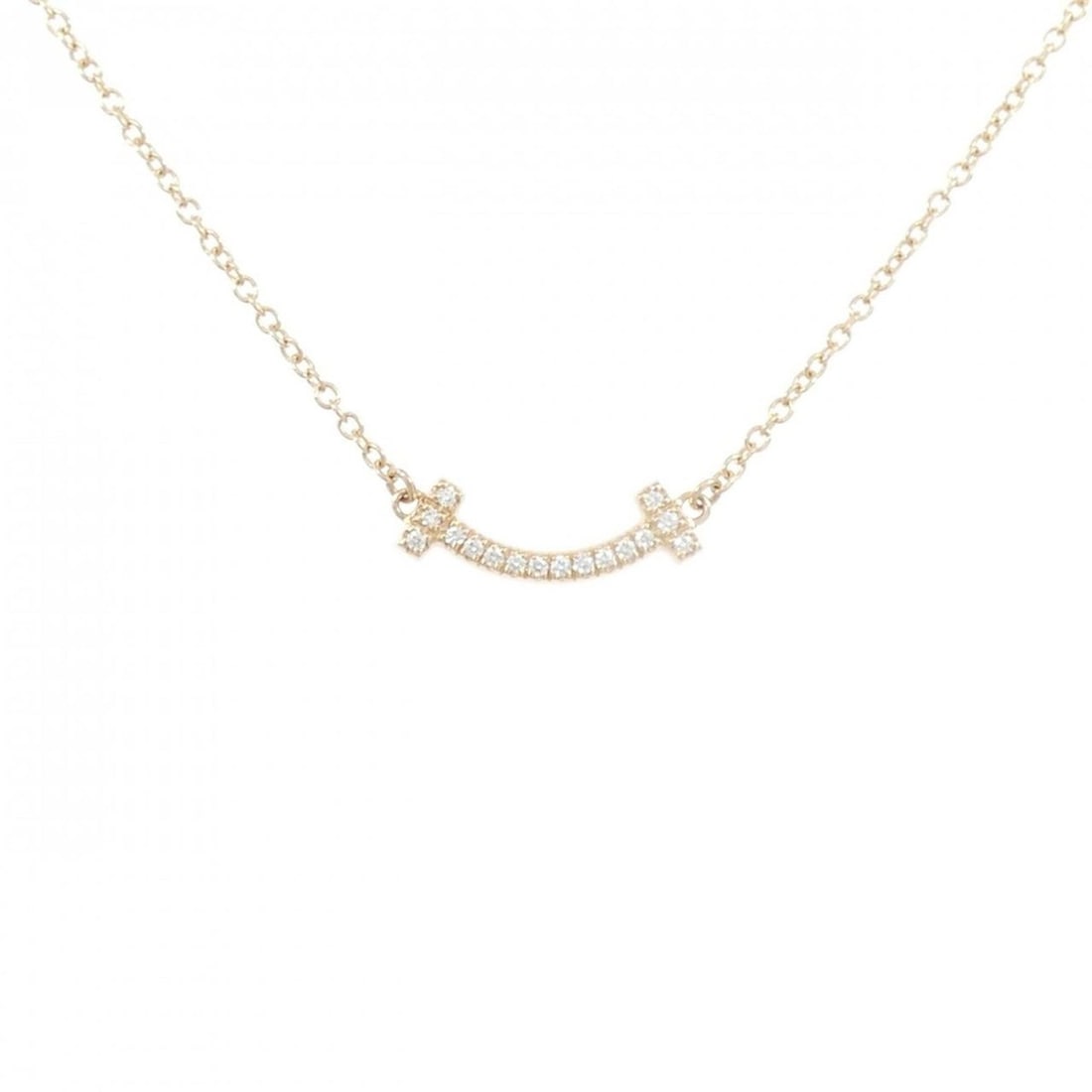 Tiffany T Smile Mini Necklace: --- Catalog ---Category: SizePendant Size: 3.8mm x 13mm / 0.14'' x 0.51''Neck Circumference: 41 cm - 45 cm / 16.14'' - 17.71''Category: DesignGender: WomenMaterial: Pink gold (18K)Pendant Type: