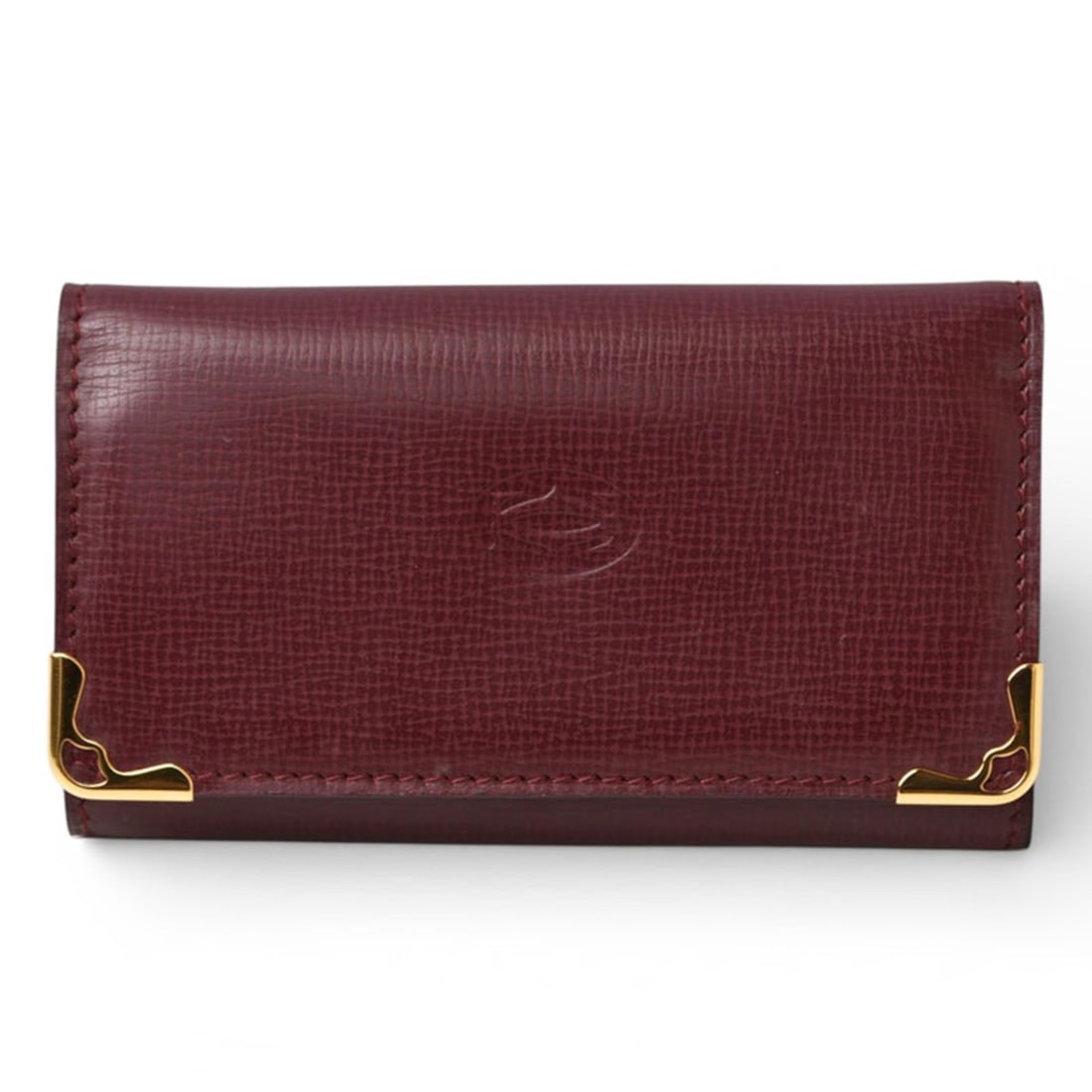 Cartier Must de 6-ring key case, Bordeaux, 2C, L3000156: --- Catalog ---Category: DesignType: KeycaseColor: BordeauxGender: Unisex,Women,MenMaterial: Leather Number of Key Hooks: 6Category: GeneralBrand: CartierCountry of Origin: FranceCategory: Physical Pr
