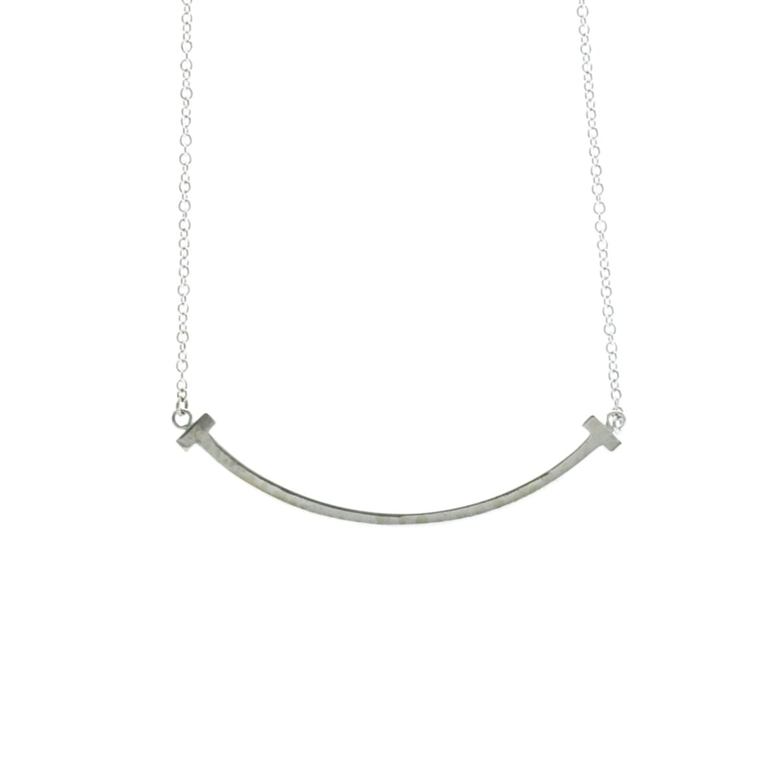 Tiffany Tiffany T Smile Small Necklace White Gold (18K) No Stone Women,Men Fashion Pendant Necklace: --- Catalog ---Category: SizeWeight: 3g / 0.1oz.Neck Circumference: 40.5 cm - 45.5 cm / 15.94'' - 17.91''Category: DesignColor: SilverMetal: White GoldStone: No StoneStyle: FashionGender: Women,MenMat