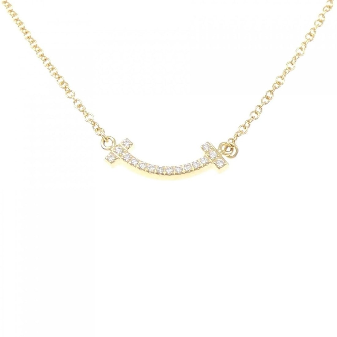 Tiffany T Smile Mini Necklace: --- Catalog ---Category: SizePendant Size: 3.6mm x 14.3mm / 0.14'' x 0.56''Neck Circumference: 40 cm - 46 cm / 15.74'' - 18.11''Category: DesignStone: DiamondGender: WomenMaterial: Yellow gold