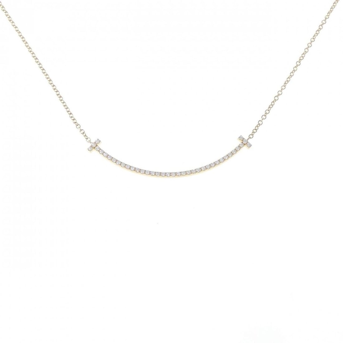 Tiffany T Smile Small Necklace: --- Catalog ---Category: SizePendant Size: 3.5mm x 37.1mm / 0.13'' x 1.46''Neck Circumference: 41 cm / 16.14''Category: DesignStone: DiamondGender: WomenMaterial: Yellow gold (18K)Pendant Type: