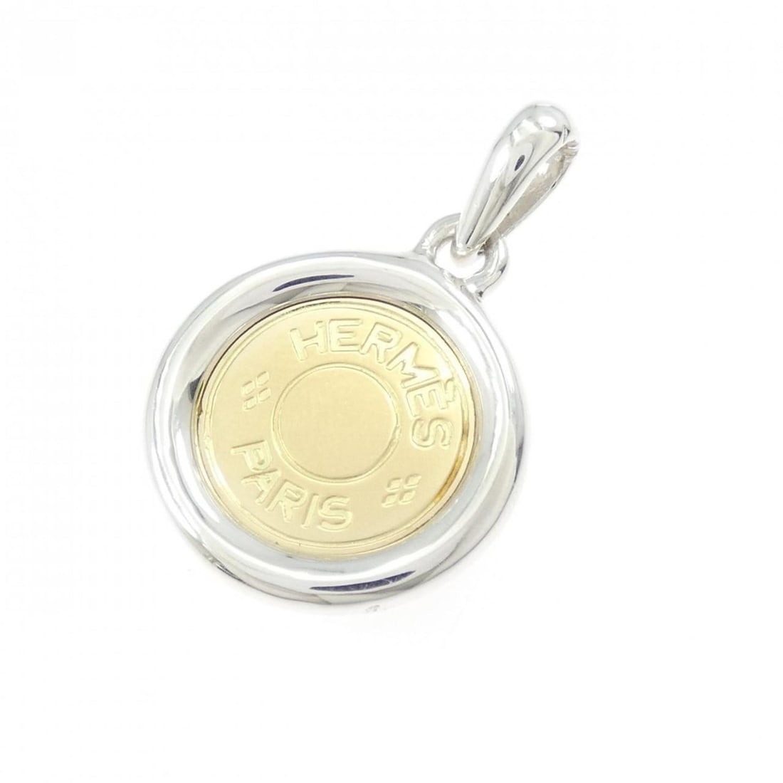 Hermes Serie pendant: --- Catalog ---Category: SizePendant Size: 30.9mm x 19.9mm / 1.21'' x 0.78''Category: DesignGender: WomenMaterial: Silver 925, Yellow gold (18K)Necklace Type: PendantCategory: GeneralBrand: Hermes---