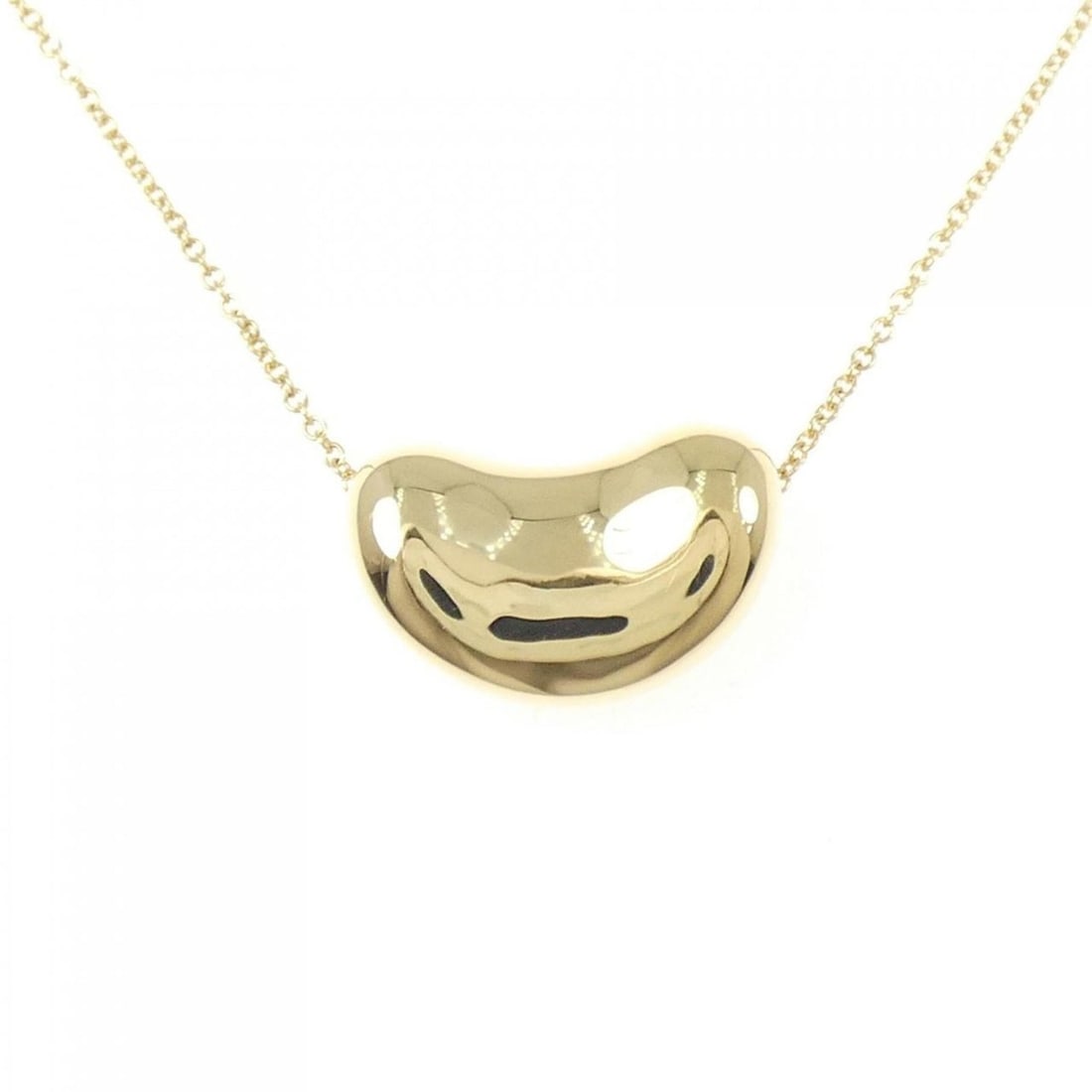 Tiffany Beans Necklace: --- Catalog ---Category: SizePendant Size: 11.9mm x 18.6mm / 0.46'' x 0.73''Neck Circumference: 40 cm / 15.74''Category: DesignGender: WomenMaterial: Yellow gold (18K)Pendant Type: PendantNecklace Typ