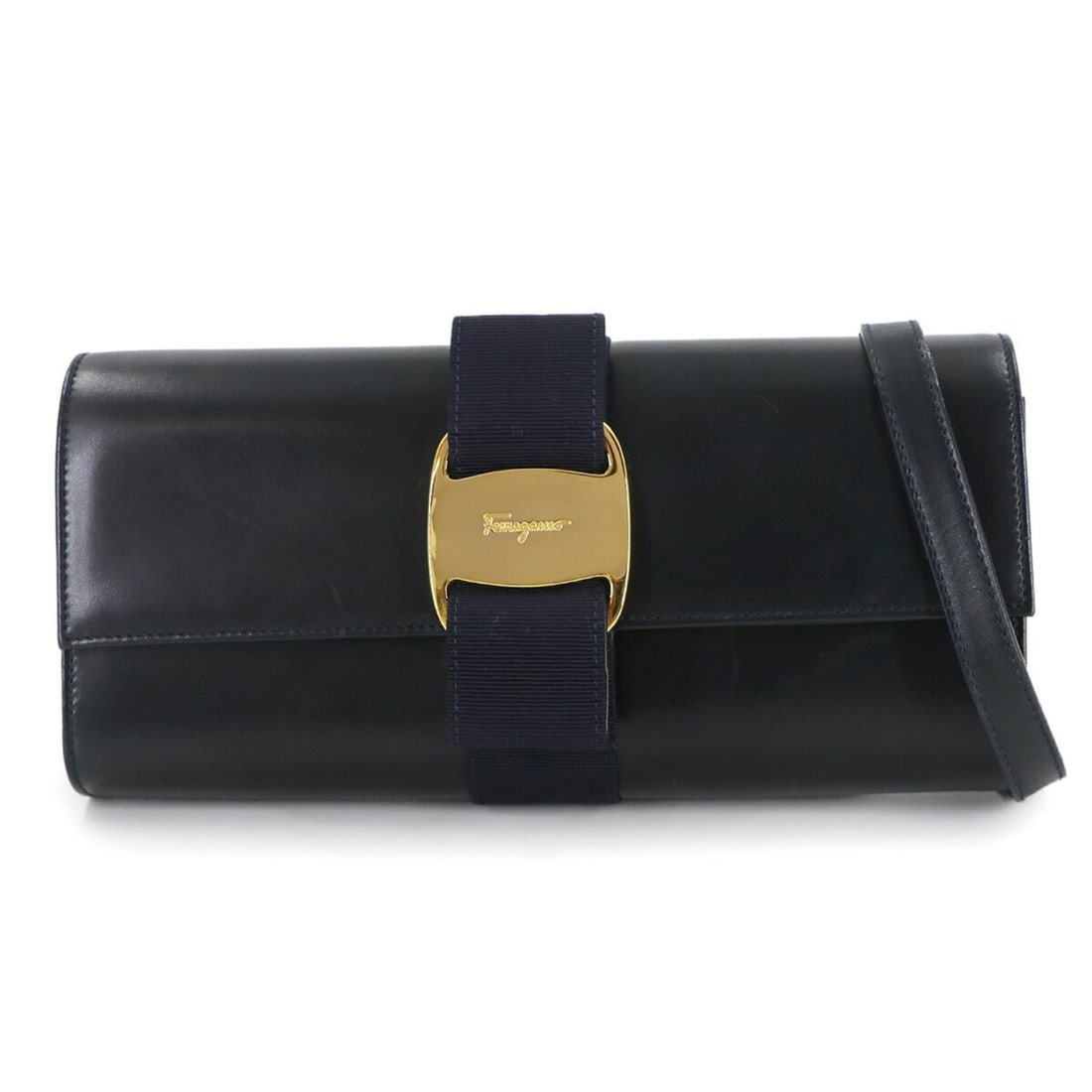 Salvatore Ferragamo Vara Ribbon 2-Way Clutch Shoulder Bag in Navy Leather (AQ-216165): --- Catalog ---Category: SizeSize (HxWxD): 12.5cm x 25cm x 5cm / 4.92'' x 9.84'' x 1.96''Category: DesignType: Shoulder bagColor: NavyGender: WomenMaterial: Leather Category: GeneralMPN: AQ-216165Bran