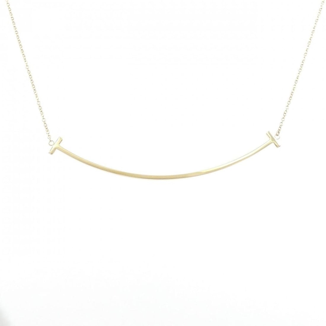 Tiffany T Smile Large Necklace: --- Catalog ---Category: SizePendant Size: 5.8mm x 68.3mm / 0.22'' x 2.68''Neck Circumference: 40 cm - 45 cm / 15.74'' - 17.71''Category: DesignGender: WomenMaterial: Yellow gold (18K)Pendant Type: