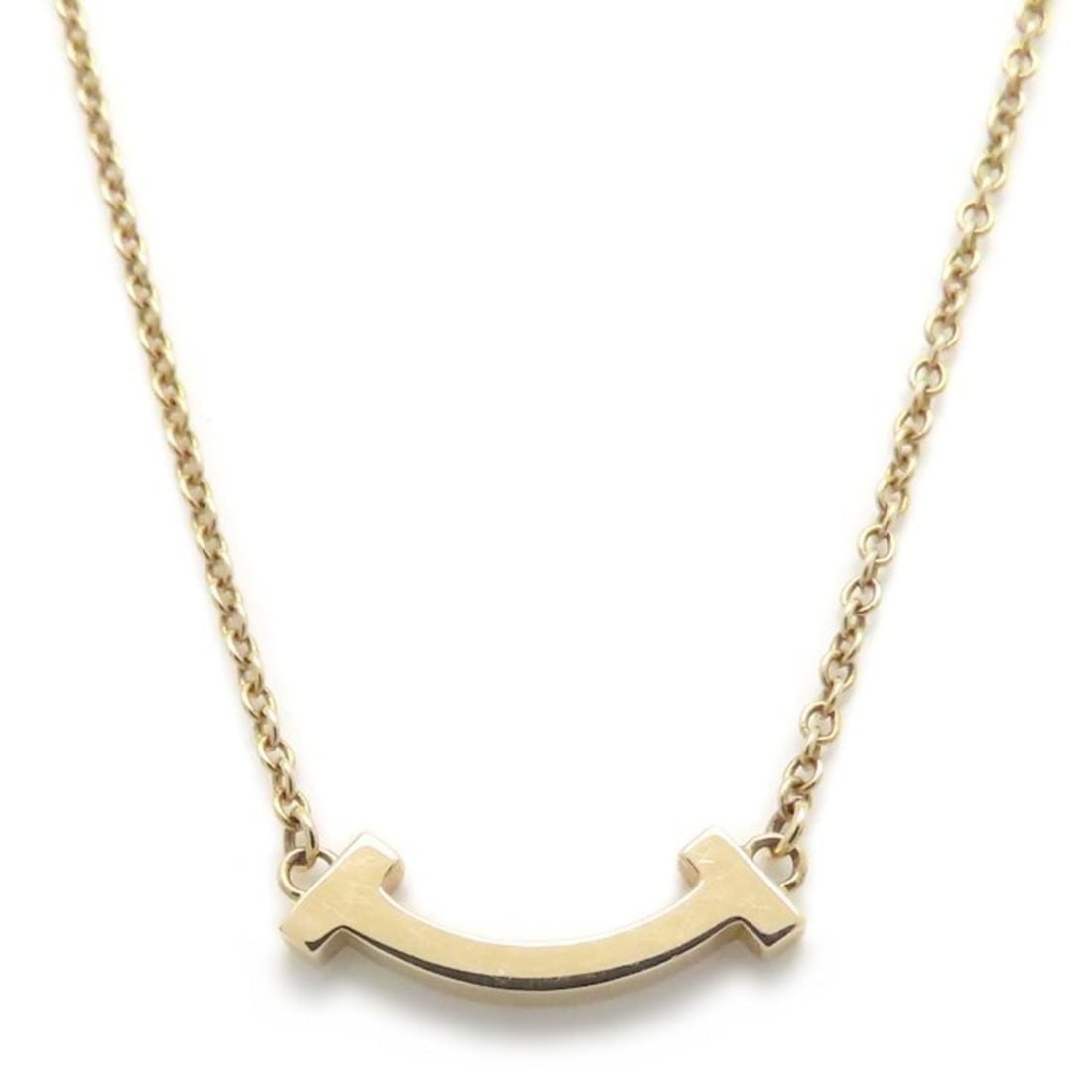 TIFFANY & Co. Tiffany T Smile Necklace Mini 18KRG Women's 295003: --- Catalog ---Category: SizeWeight: 2.3g / 0.08oz.Pendant Size: 3.6mm x 13.5mm / 0.14'' x 0.53''Neck Circumference: 40.5 cm - 45.5 cm / 15.94'' - 17.91''Category: DesignGender: WomenMaterial: Rose