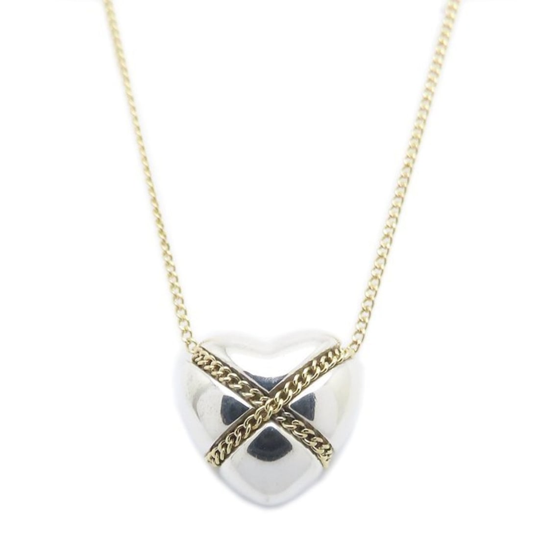 TIFFANY & Co. Tiffany Cross Heart Necklace in SV925 and 18KYG, Women's, 295052: --- Catalog ---Category: SizeWeight: 6g / 0.21oz.Pendant Size: 11.9mm x 12.3mm / 0.46'' x 0.48''Neck Circumference: 45.5 cm / 17.91''Category: DesignGender: WomenMaterial: Silver 925, Yellow gold (18K
