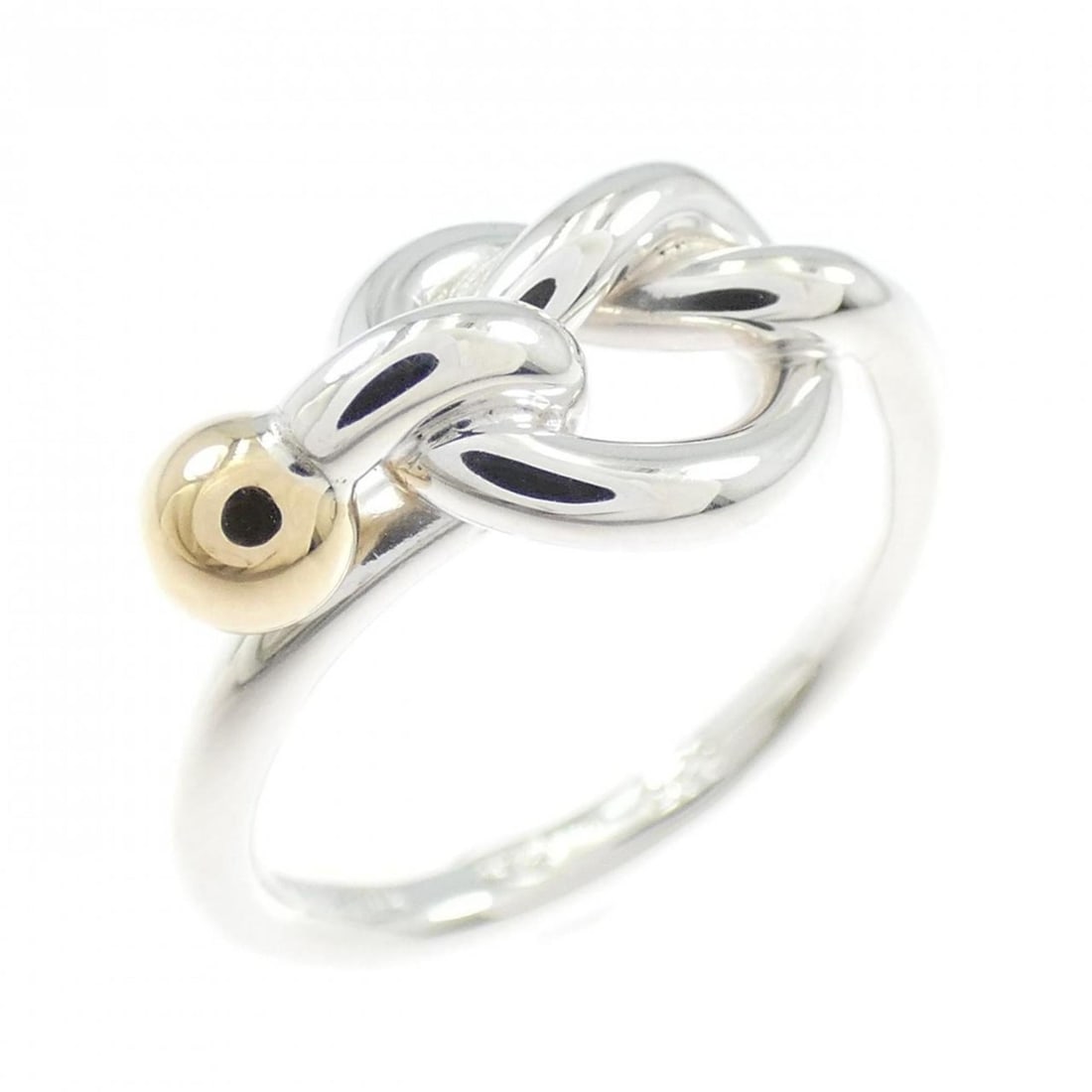Tiffany Love Knot Ring: --- Catalog ---Category: SizeJP Size: 9US Size: 5Category: DesignType: Band ringColor: Gold, SilverGender: WomenMaterial: Silver 925, Yellow gold (18K)Category: GeneralBrand: Tiffany--- Item List