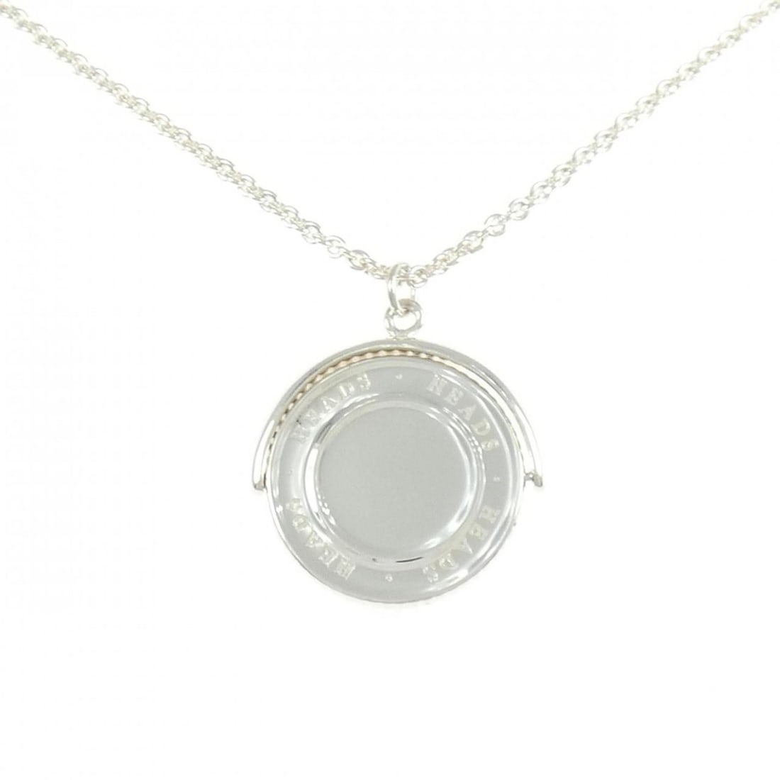 Tiffany Coin Edge Necklace: --- Catalog ---Category: SizePendant Size: 28.1mm x 26.1mm / 1.1'' x 1.02''Neck Circumference: 46 cm / 18.11''Category: DesignColor: SilverGender: WomenMaterial: Silver 925Pendant Type: