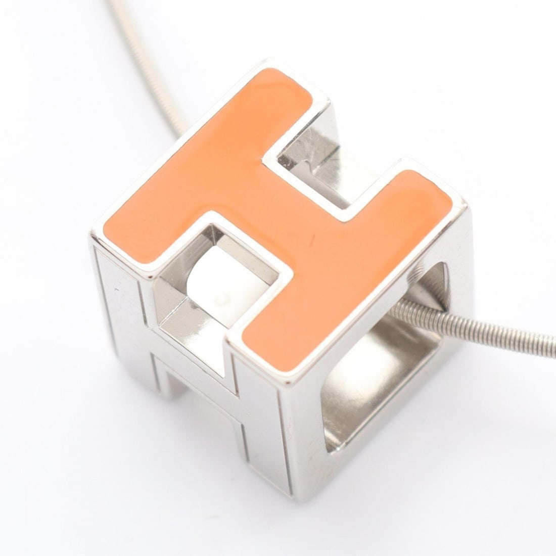 Hermes Hermès H-Cube Necklace in Stainless Steel, Silver and Orange, for Women: --- Catalog ---Category: SizePendant Size: 12mm x 12mm / 0.47'' x 0.47''Neck Circumference: 43 cm / 16.92''Category: DesignColor: Orange, SilverGender: WomenMaterial: Stainless steelNecklace Type: Nec
