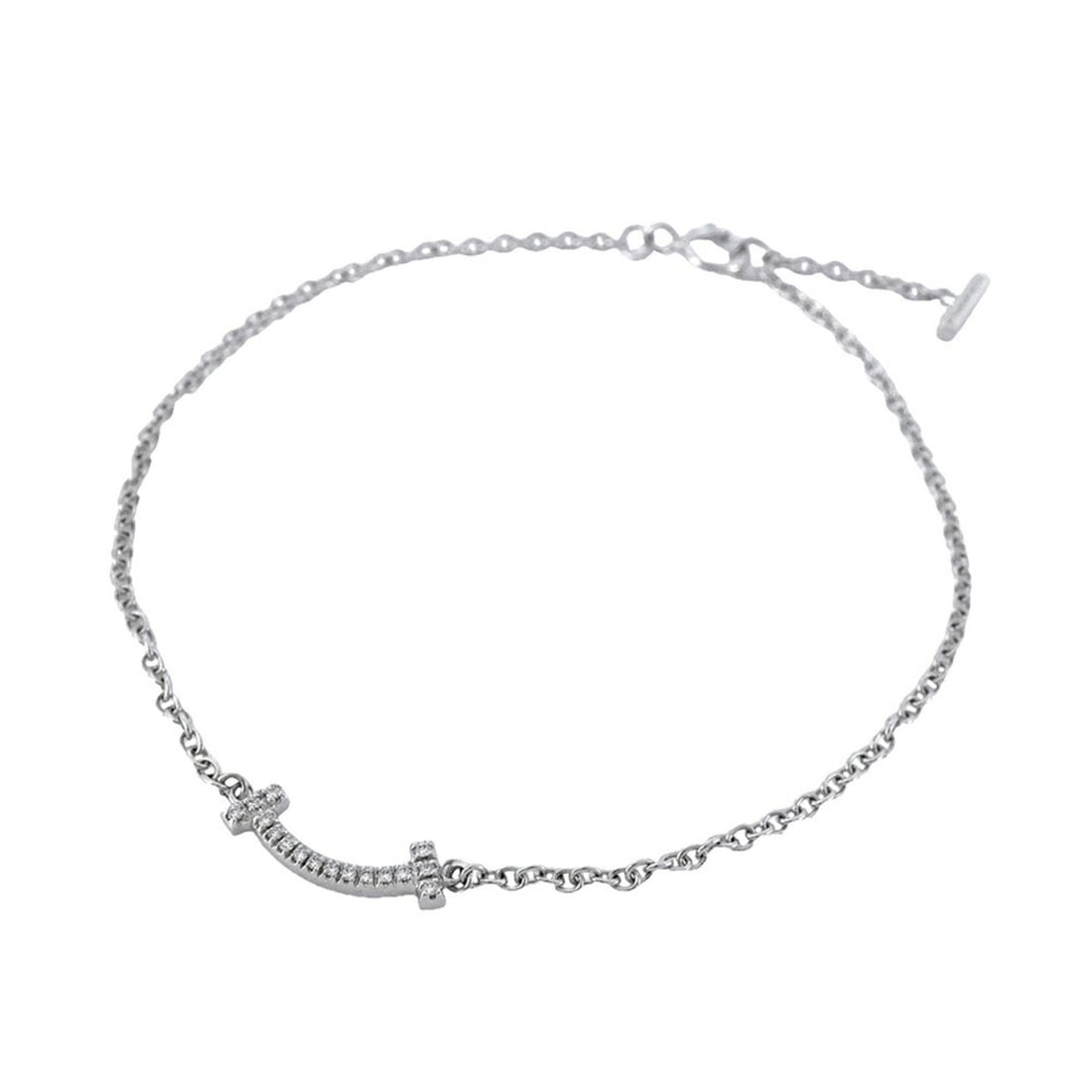 Tiffany T Smile Mini Bracelet in 18K White Gold with Diamonds for Women: --- Catalog ---Category: SizeLength: 16cm / 6.29''Category: DesignType: Charm braceletStone: DiamondGender: WomenMaterial: White gold (18K)Category: GeneralBrand: Tiffany--- Item List ---Section: Cond