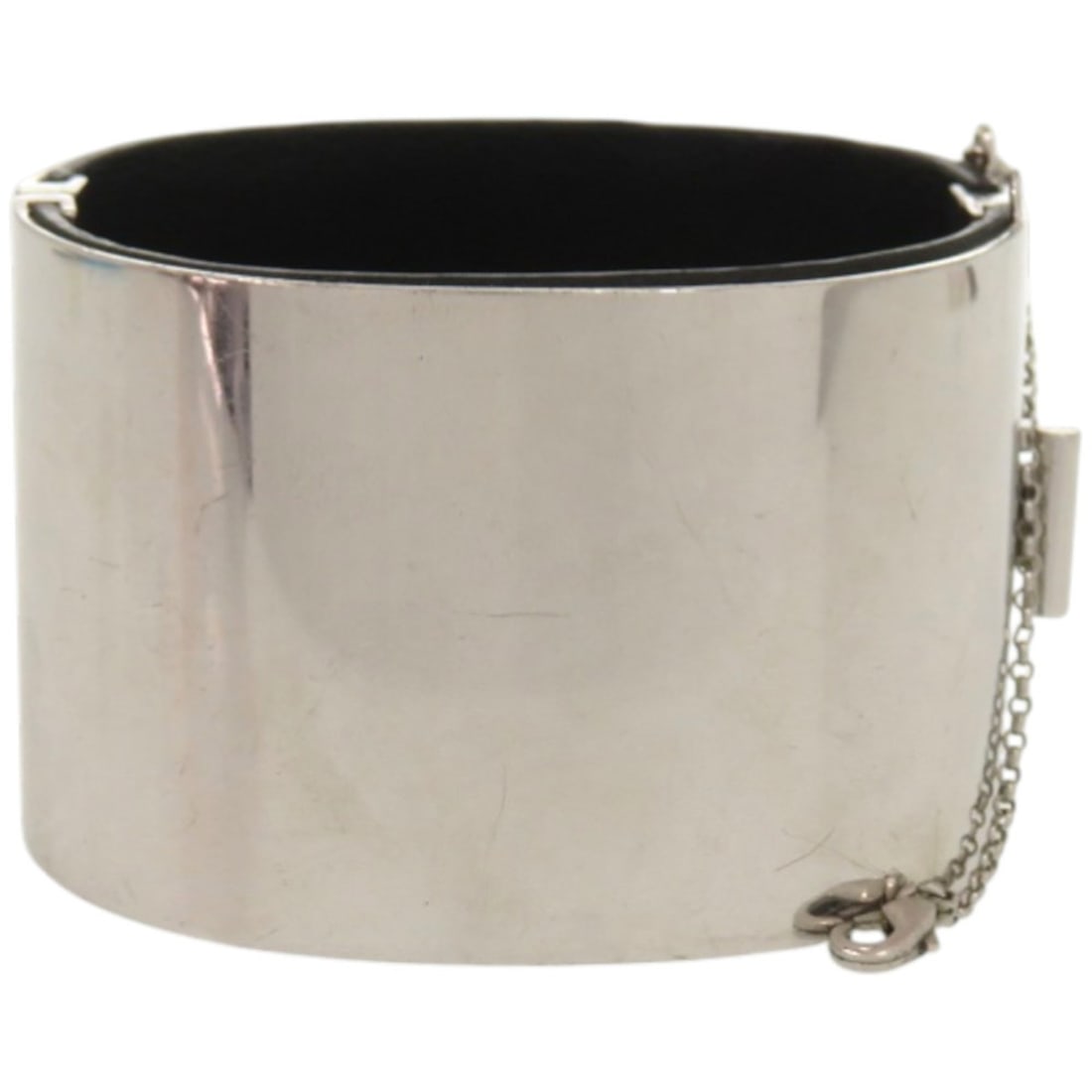 Excellent condition Celine Manchette metal, leather and silver bangle 1232CELINE: --- Catalog ---Category: SizeSize: MWidth: 4cm / 1.57''Length: 16.5cm / 6.49''Category: DesignType: BangleColor: Black, SilverGender: WomenMaterial: Leather, MetalCategory: GeneralBrand: Celine--- Ite