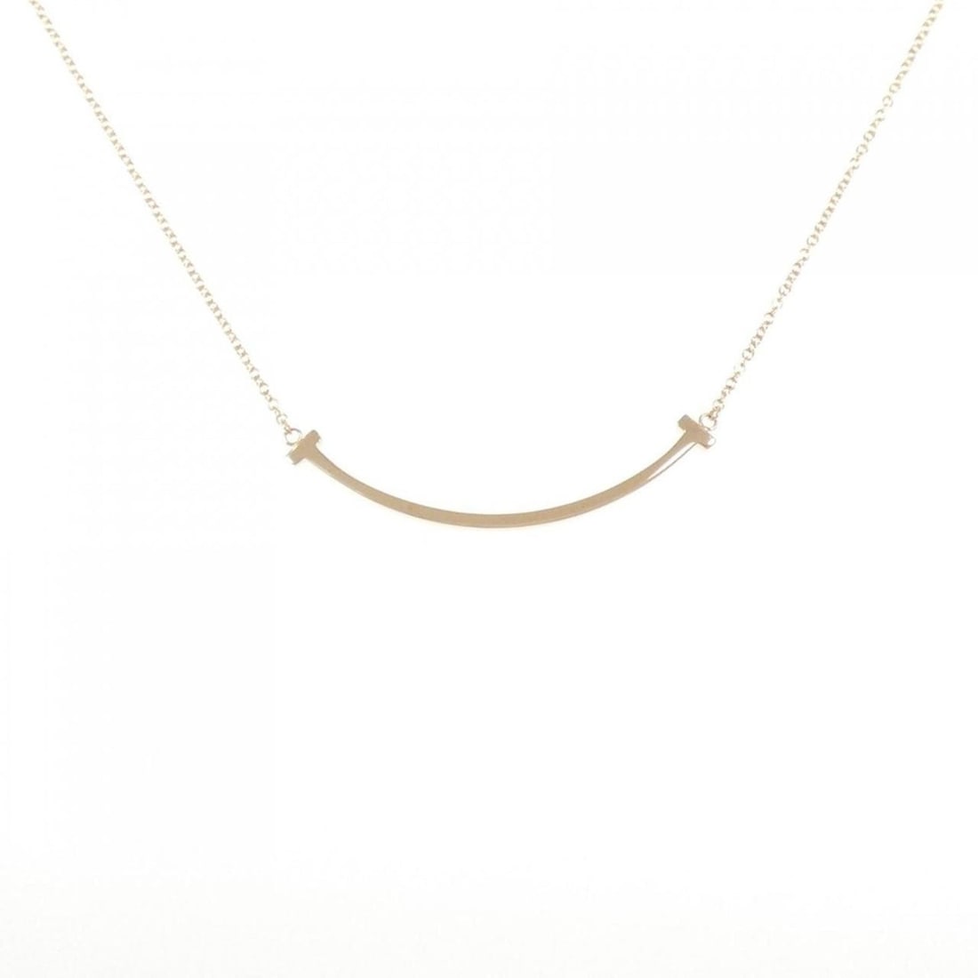 Tiffany T Smile Small Necklace: --- Catalog ---Category: SizePendant Size: 3.7mm x 37.3mm / 0.14'' x 1.46''Neck Circumference: 40 cm - 45 cm / 15.74'' - 17.71''Category: DesignGender: WomenMaterial: Pink gold (18K)Pendant Type: